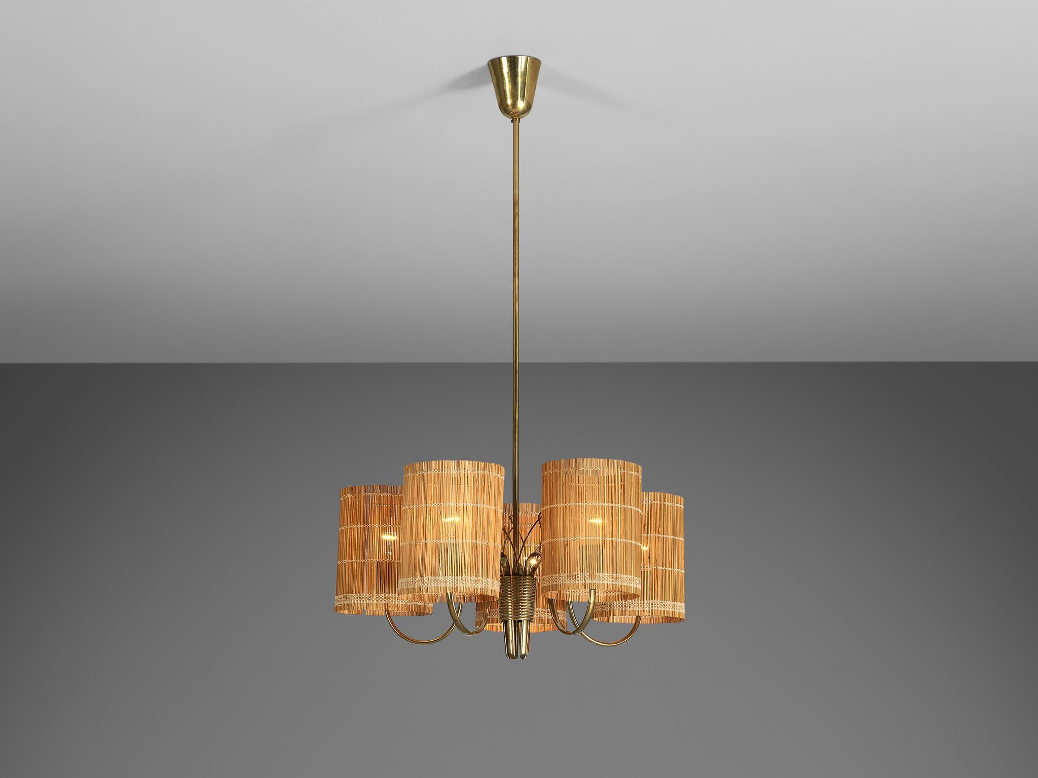 Paavo Tynell for Taito, '9031' chandelier, brass, cane, fabric, Finland, 1950s

A truly magnificent piece that scores highly on every design aspect: execution, use of materials, craftsmanship, and detail. Beautiful chandelier designed by Finnish