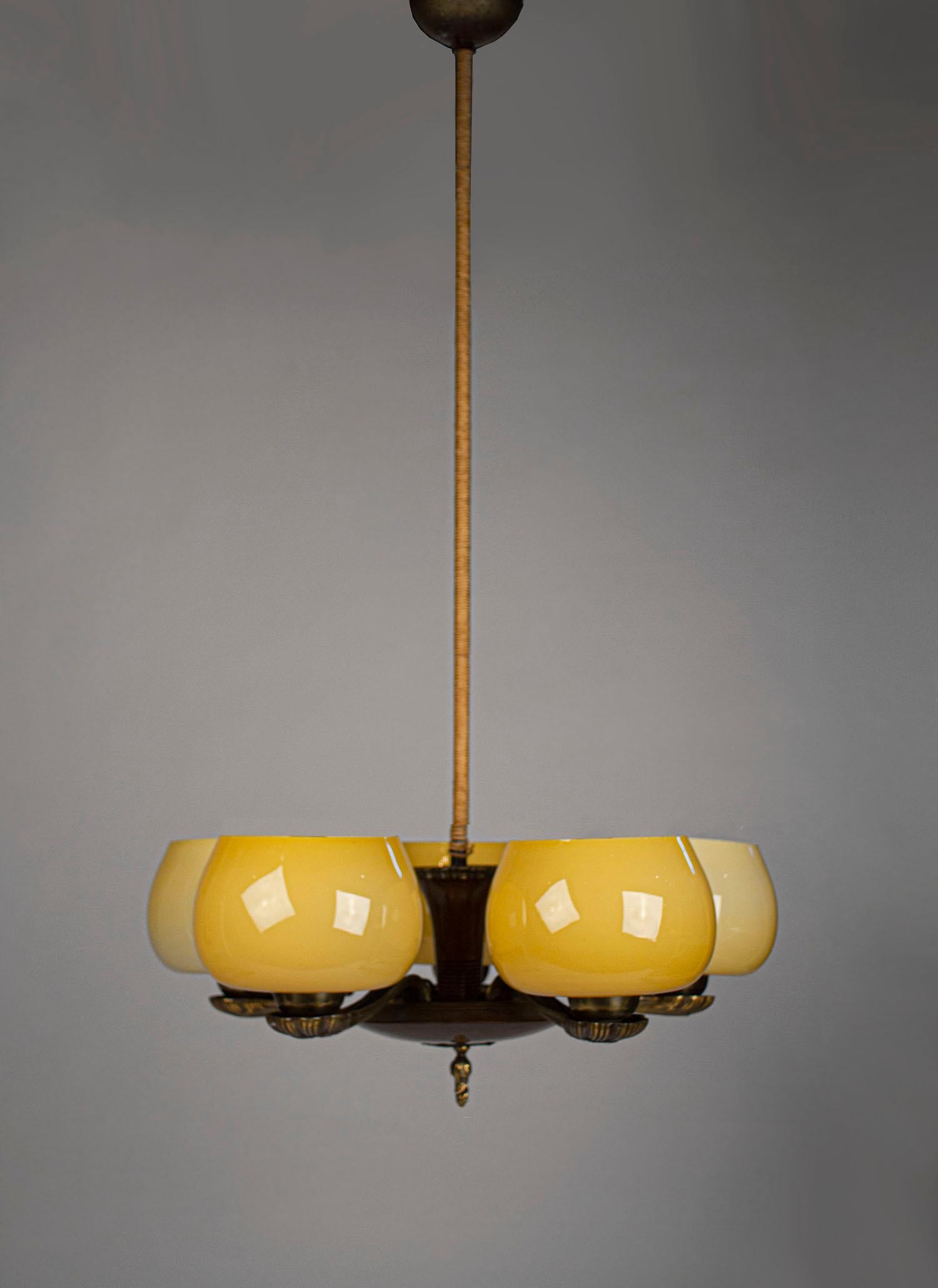 Early and uncommonly seen chandelier designed by Paavo Tynell for Taito Model, 1376. Includes original cloth wrapped down rod and ceiling cap. The lamp is marked.

Each shade measures 4.25