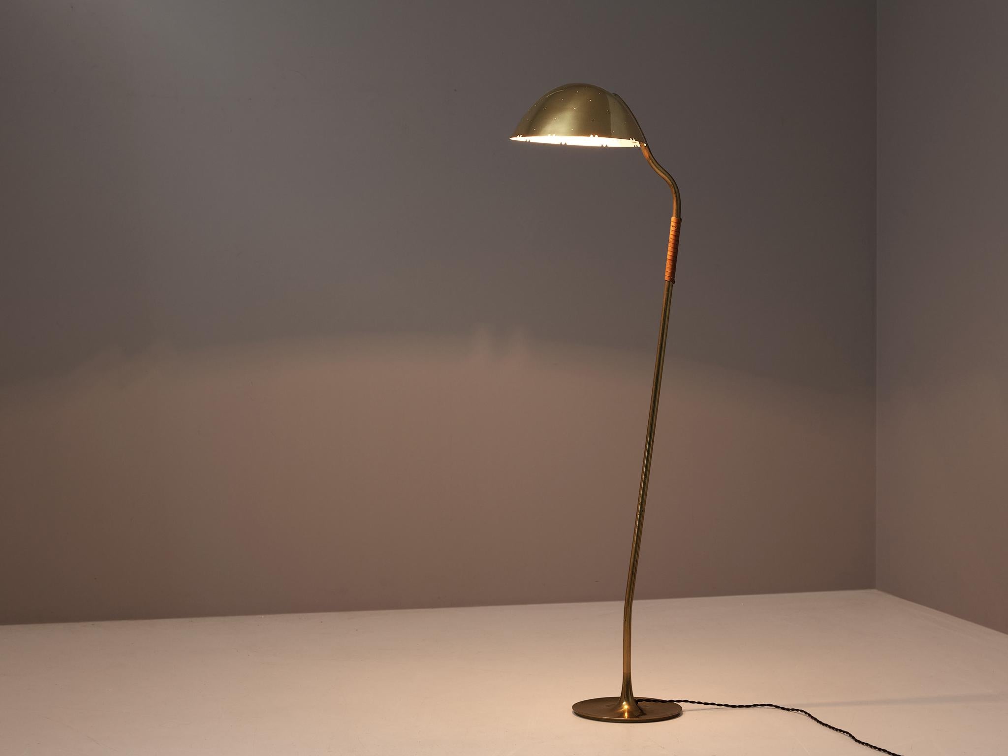 Paavo Tynell for Taito Oy, floor lamp, model 9608, brass, leather, Finland, 1950s. 

Elegant floor lamp by Finnish master of lights Paavo Tynell. This admirable floor lamp stands on a delicate round brass base from which a thin brass stem rises