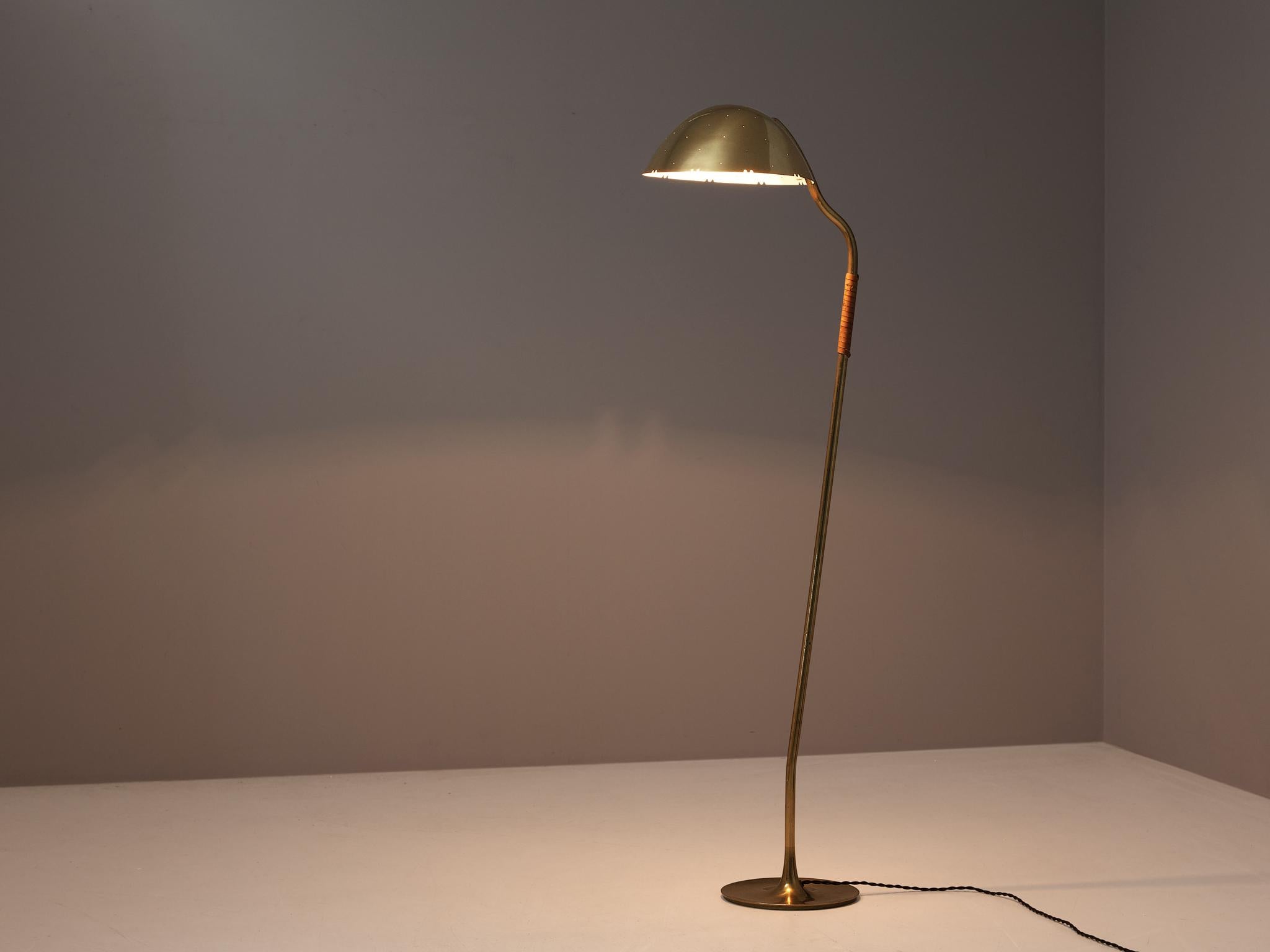 Paavo Tynell for Taito Oy, floor lamp, model 9608, brass, leather, Finland, 1950s. 

Elegant floor lamp by Finnish master of lights Paavo Tynell. This admirable floor lamp stands on a delicate round brass base from which a thin brass stem rises