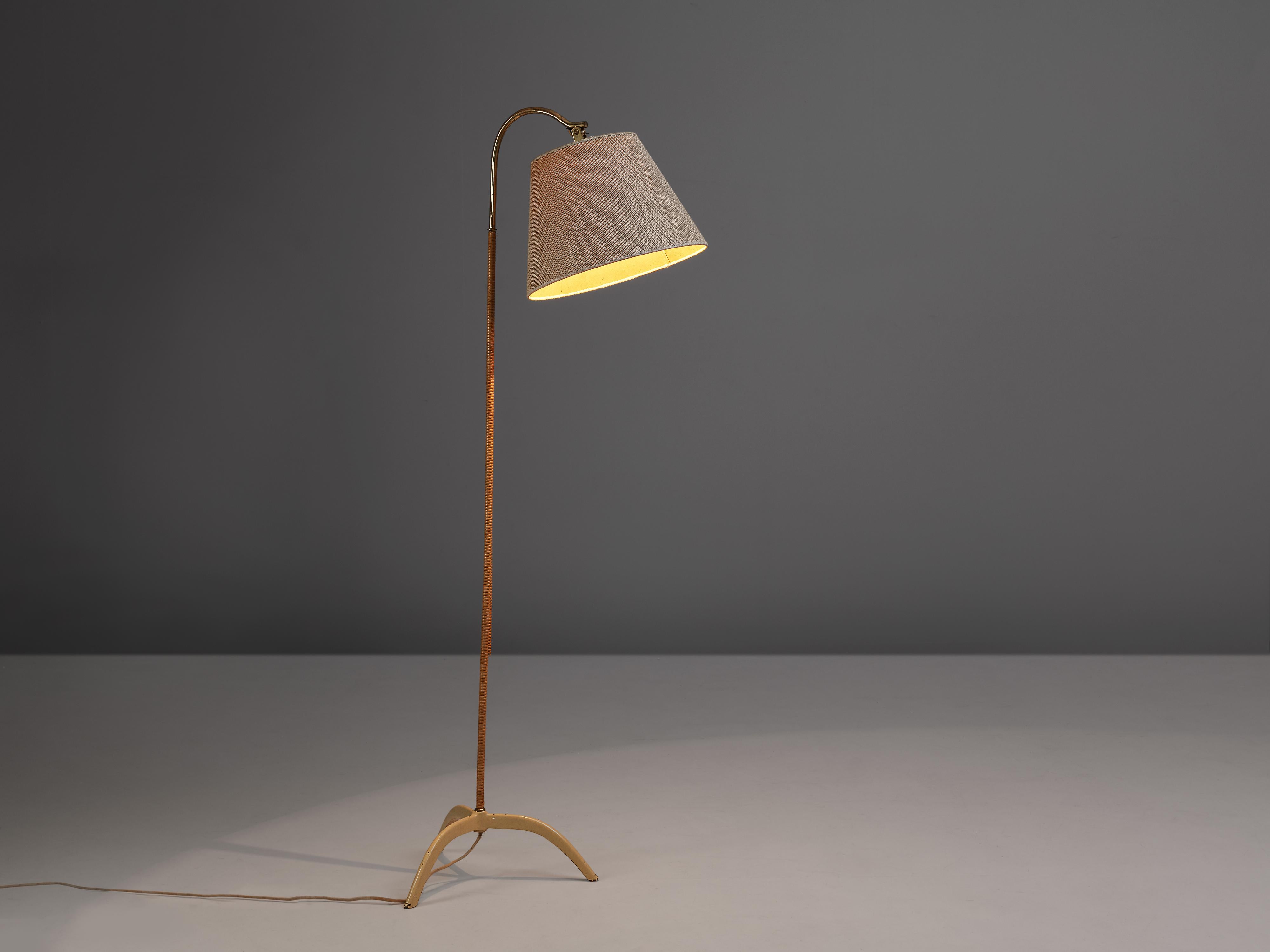 Paavo Tynell for Taito, floor lamp model 9609, metal, brass, cane, fabric, Finland, 1950s

The floor lamp model 9609 by Finish designer Paavo Tynell is a visual pleasure in many senses. Firstly, the surprising lines of the tripod base. In for