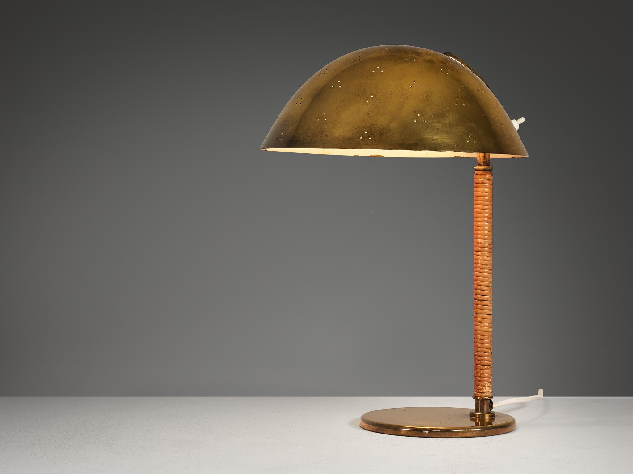 Paavo Tynell for Taito Oy, table lamp, model ‘9209’, brass, cane, Finland, circa 1950 

A truly magnificent piece that scores highly on every design aspect: execution, material use, craftsmanship, and detail. Paavo Tynell, the master in the fields