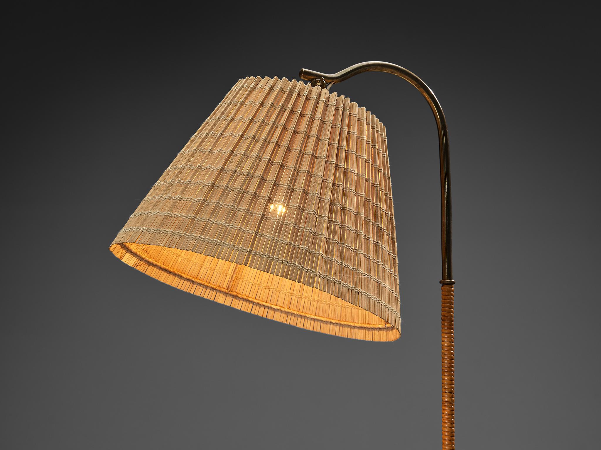 Finnish Paavo Tynell for Taito Oy '9609' Floor Lamp in Cane and Brass For Sale