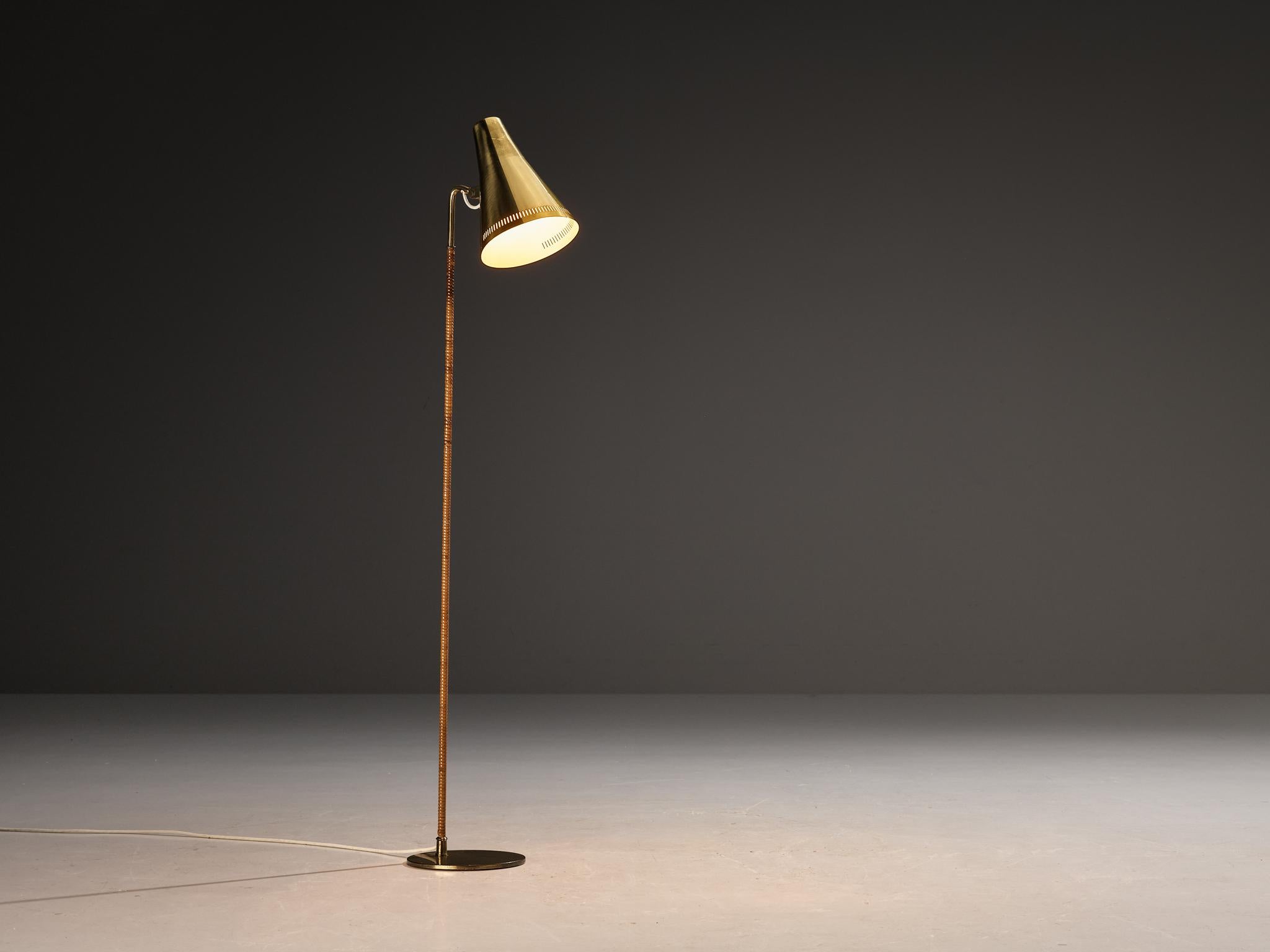 Paavo Tynell for Taito Oy, floor lamp, model 'K10', coated aluminum, brass, cane, Finland, 1950s 
 
Outstanding floor lamp designed by Paavo Tynell, the Finnish design master of lighting. This delicate floor lamp has a few distinct features. The
