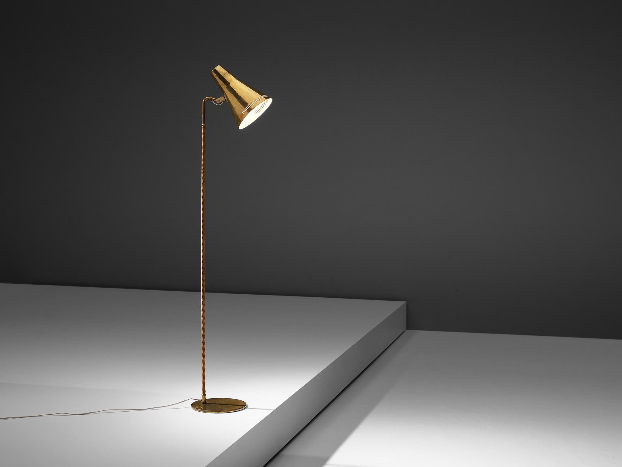 Paavo Tynell for Taito Oy, floor lamp, model 'K10', lacquered metal, brass, cane, Finland, 1950s 

Outstanding floor lamp designed by Paavo Tynell, the Finnish design master of lighting. These delicate floor lamps have a few distinct features. The