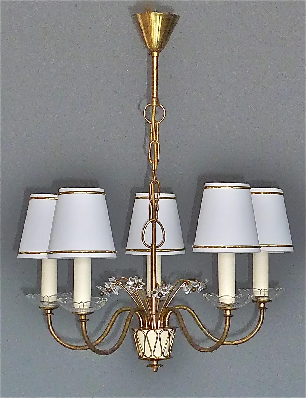 Gorgeous Josef Frank attribution midcentury chandelier most probably made by Svenskt Tenn, Austria or Sweden, early 1950s. The rare patinated brass chandelier has 5 scrolled arms with faceted crystal glass bobeches, a beautiful center with a