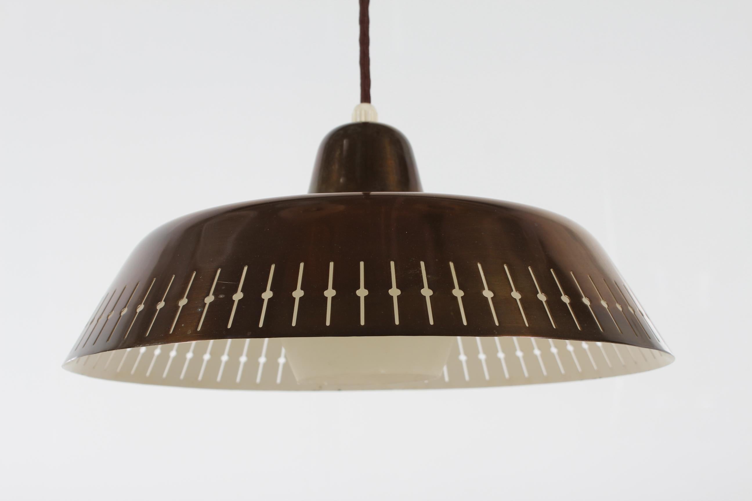 Danish Paavo Tynell Manner Pedant Light of Brass with Perforated Pattern 1950s  For Sale