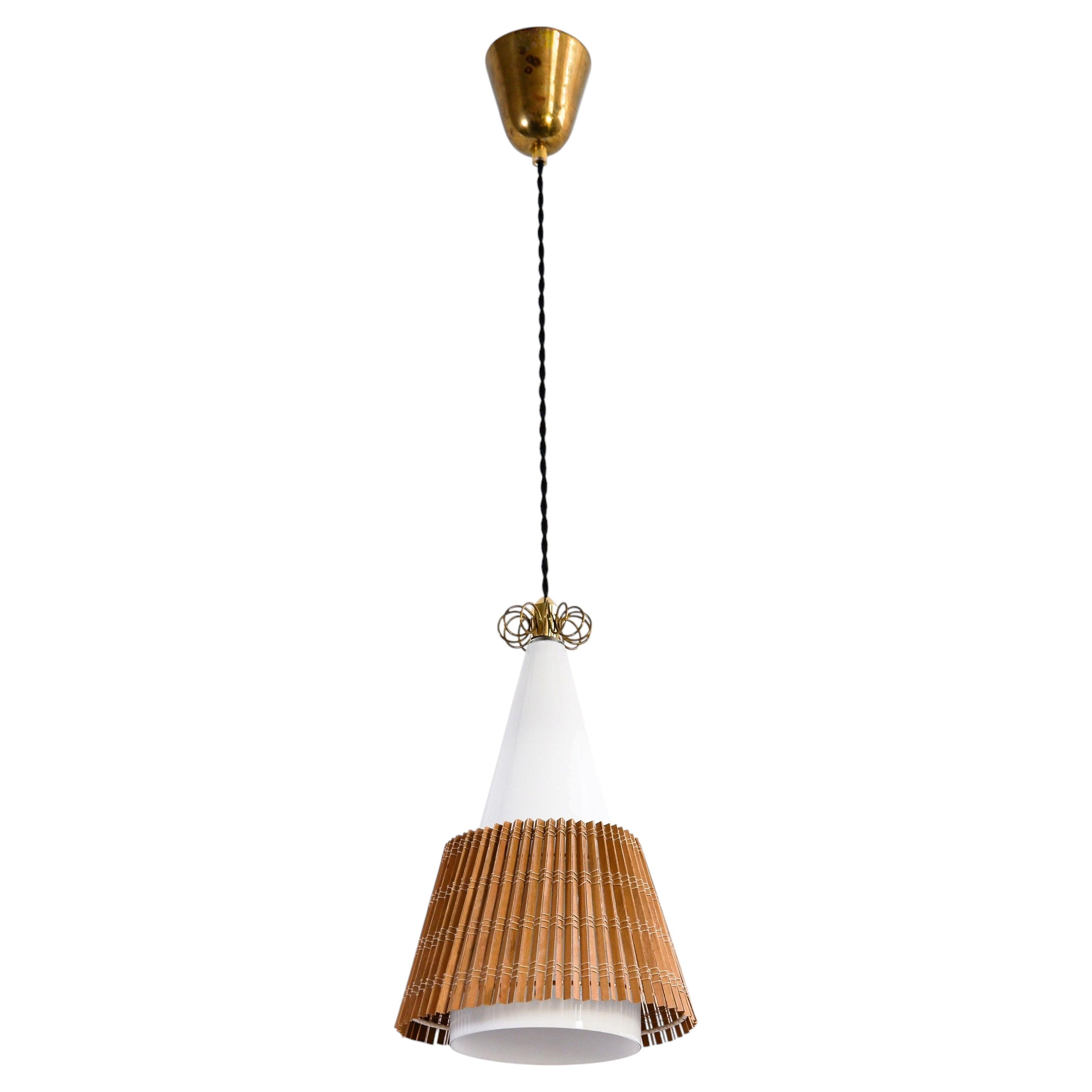 Paavo Tynell model 1082, rattan shade, circa 1960. For Sale