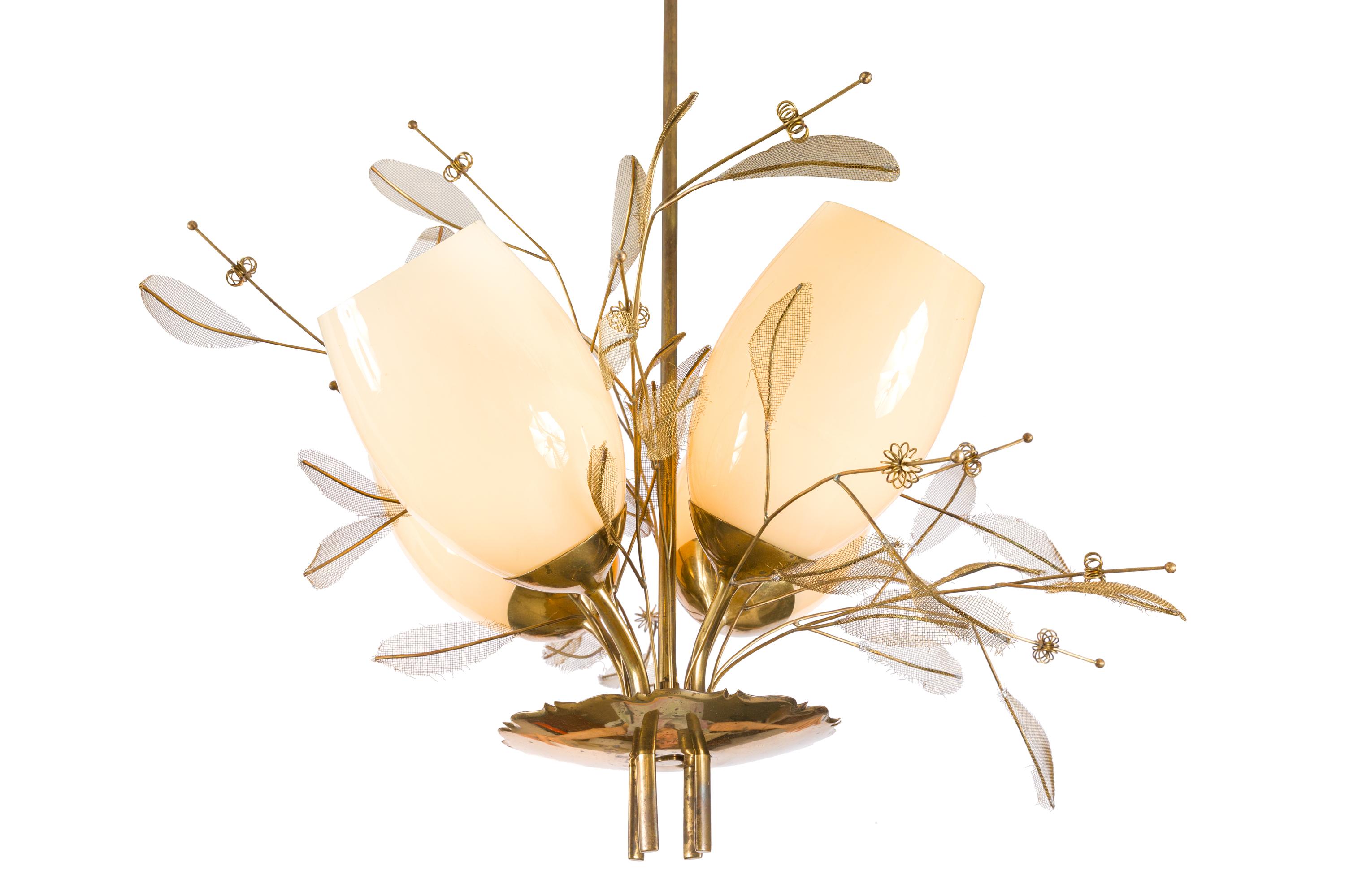 A Classic Tynell chandelier with the distinctive brass floral decoration. Paavo Viljo Tynell was a Finnish designer who is best known for his lighting fixtures and lamps. Among other things, Tynell designed the lighting for the office of the