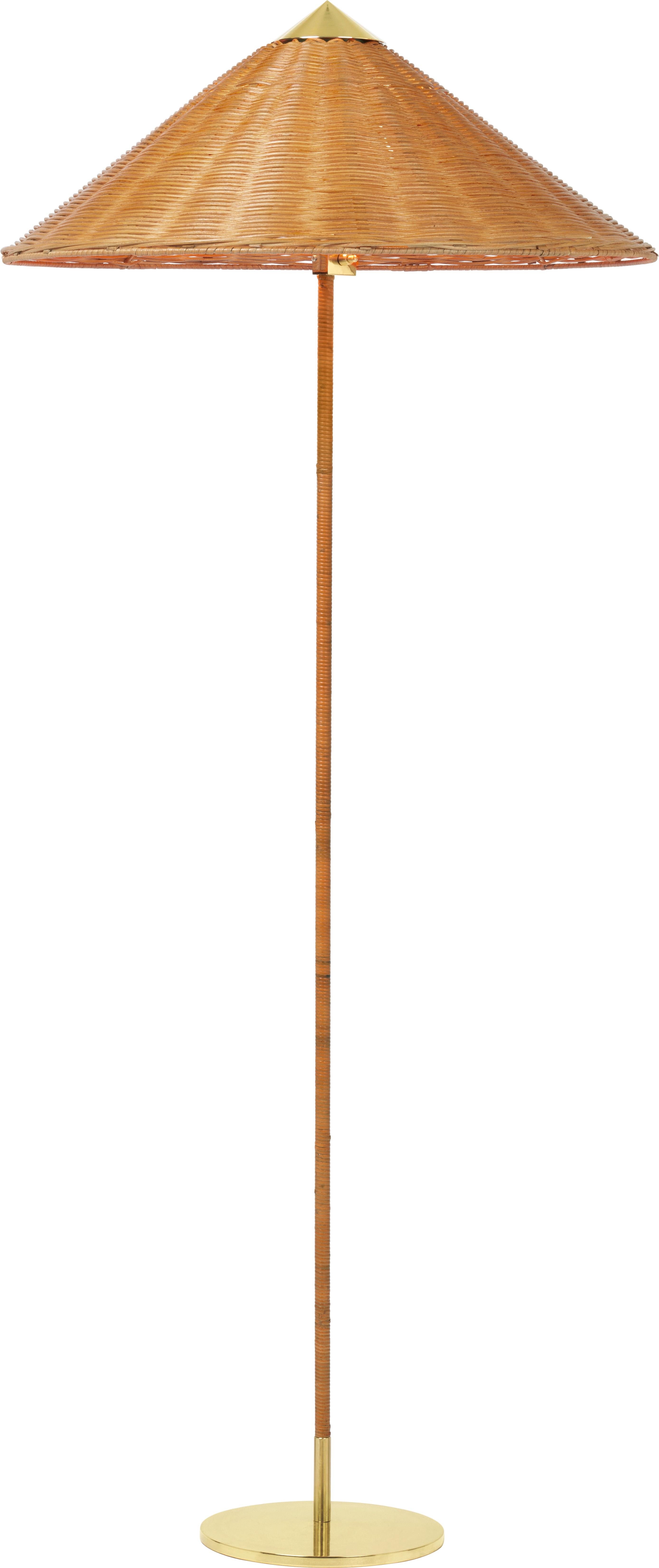 Paavo Tynell Model 9602 brass and rattan floor lamp. Originally designed by Paavo Tynell in 1935, this authorized GUBI re-edition is executed in brass, rattan and a fabric shade with brass finial. The 9602 floor lamp, also known as “Chinese Hat” was