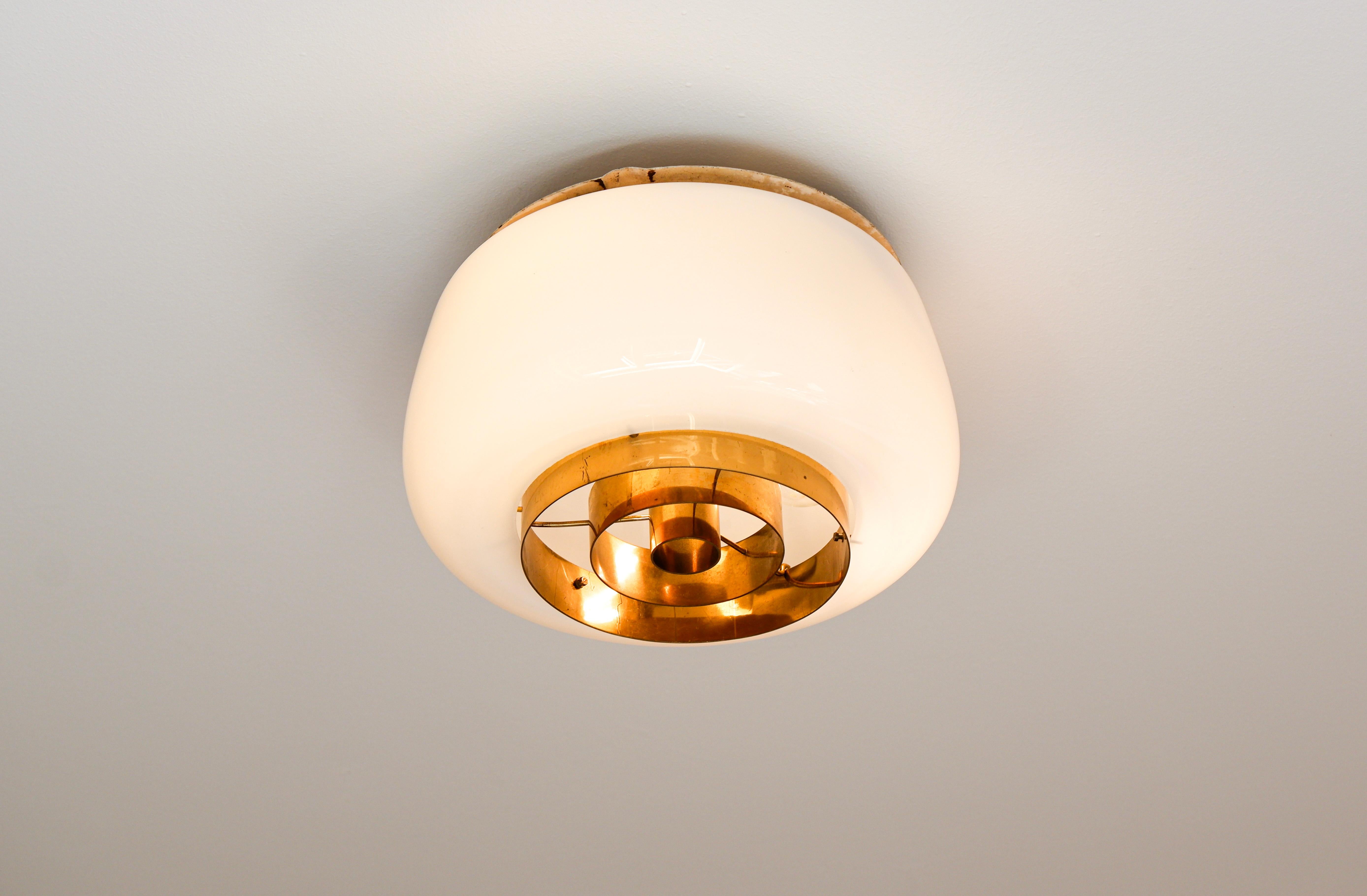 Mid-20th Century Paavo Tynell model H2-70 for Idman, Opal glass & brass, 1955.