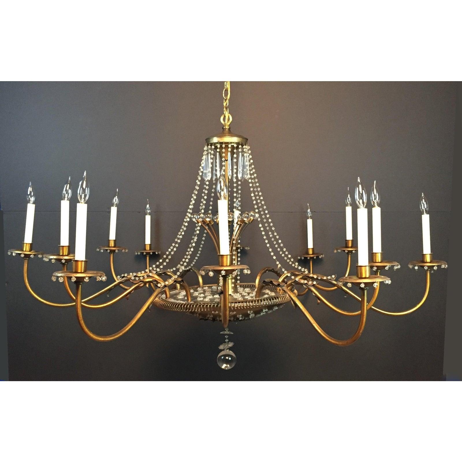 Paavo Tynell (attrib.) brass and glass chandelier of large monumental size.  No visible makers mark. Most likely a custom item.


