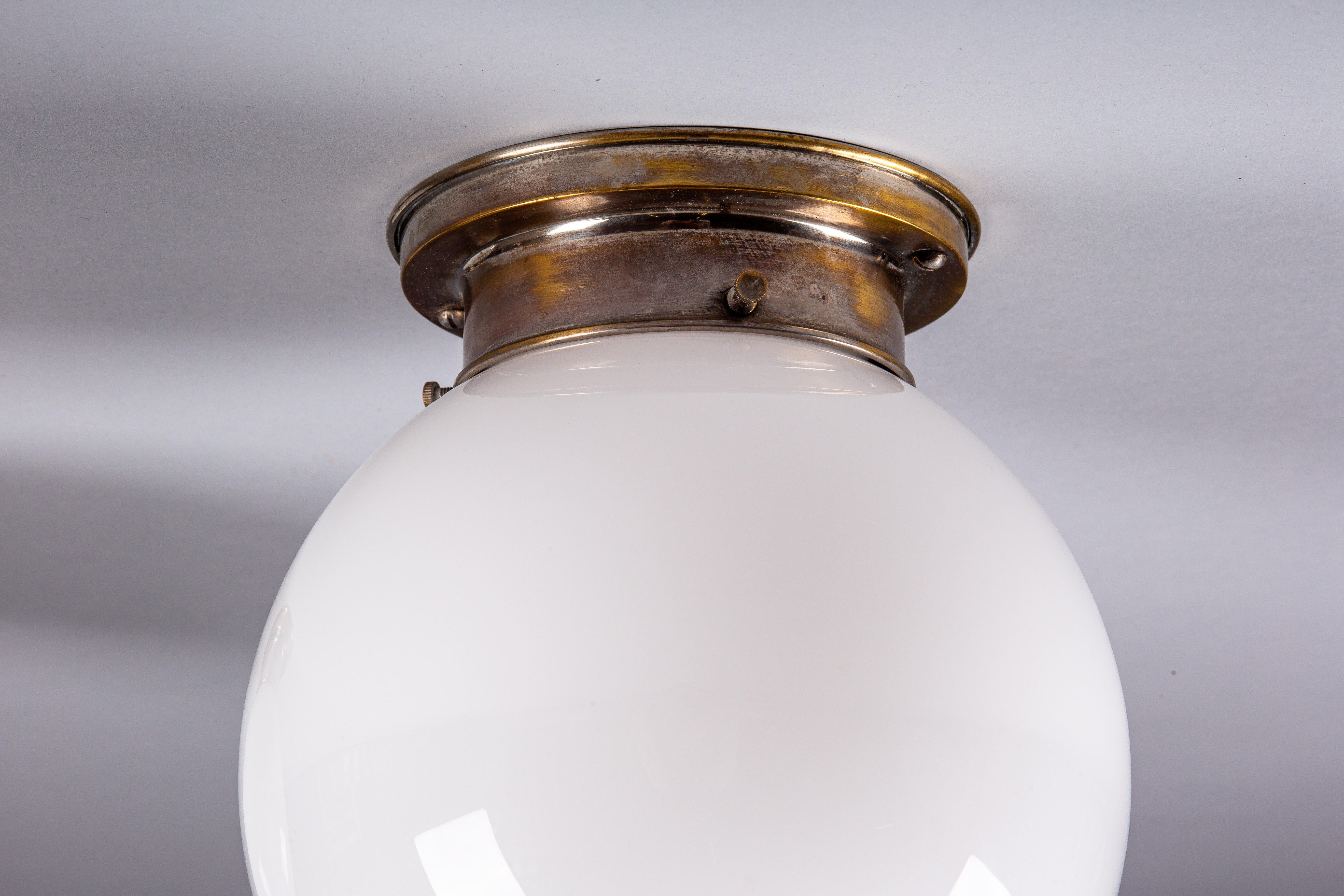 Plated Paavo Tynell, pair of 1930's opaline glass flush mount lamps for Idman Oy