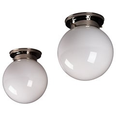 Paavo Tynell, pair of 1930's opaline glass flush mount lamps for Idman Oy