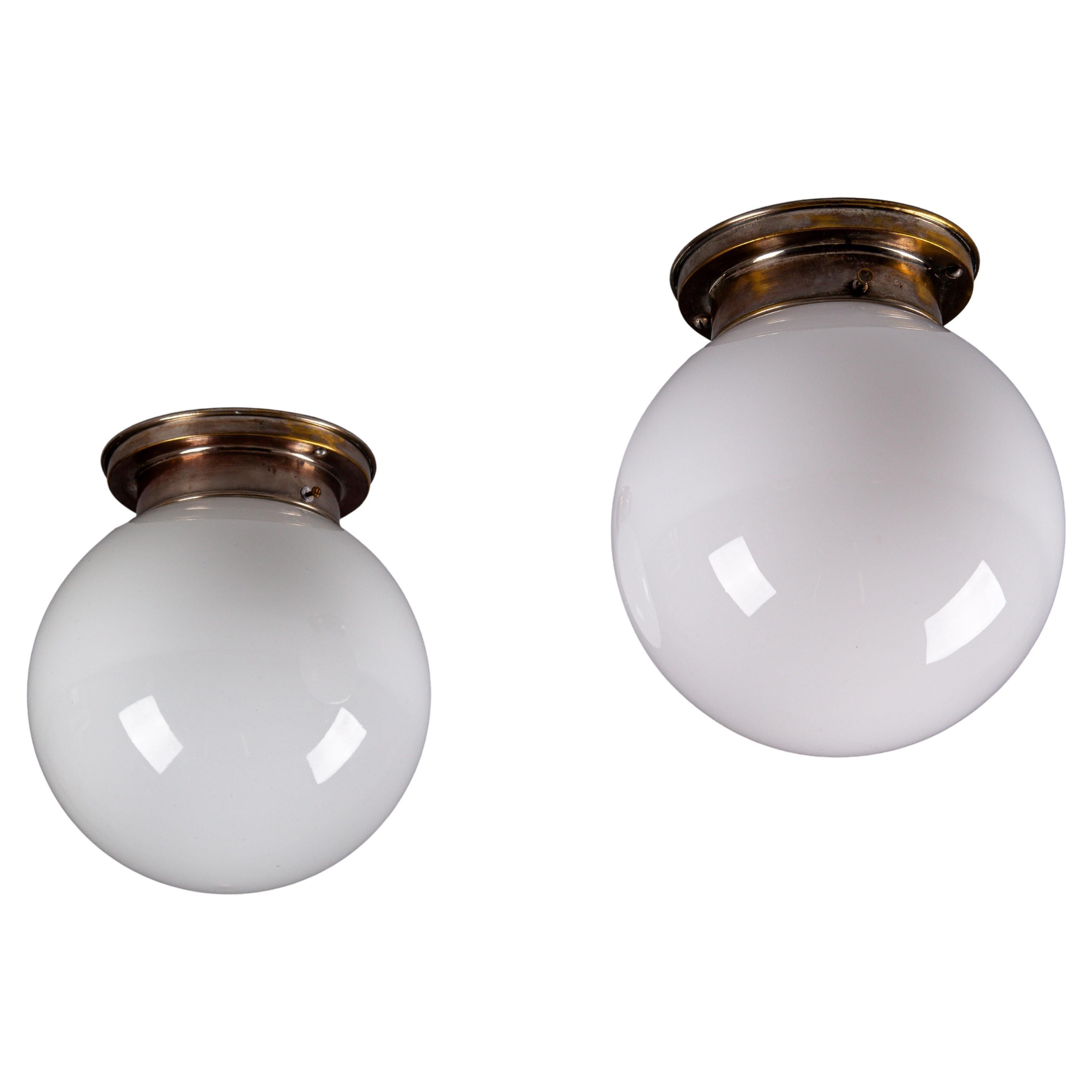 Paavo Tynell, pair of 1930's opaline glass flush mount lamps for Idman Oy