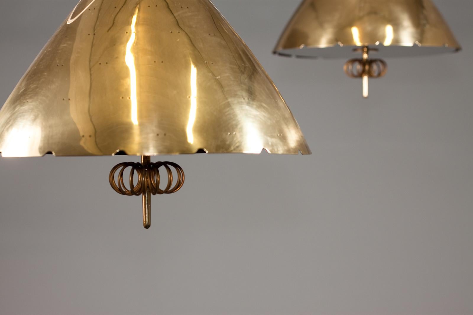 Paavo Tynell, pair of 1940's brass counterweight pendant lamps, Taito Oy 2