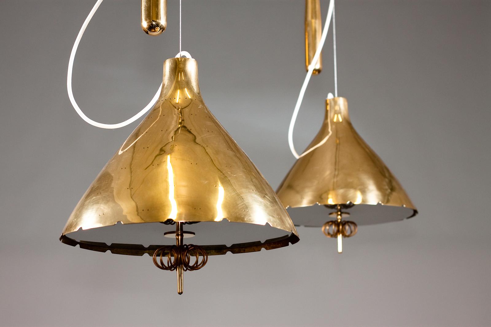 Paavo Tynell, pair of 1940's brass counterweight pendant lamps, Taito Oy 3