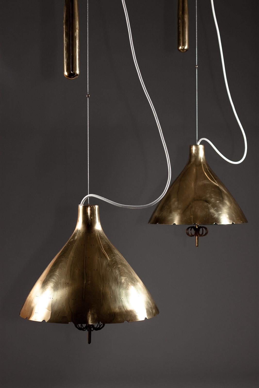 Paavo Tynell, pair of 1940's brass counterweight pendant lamps, Taito Oy 4