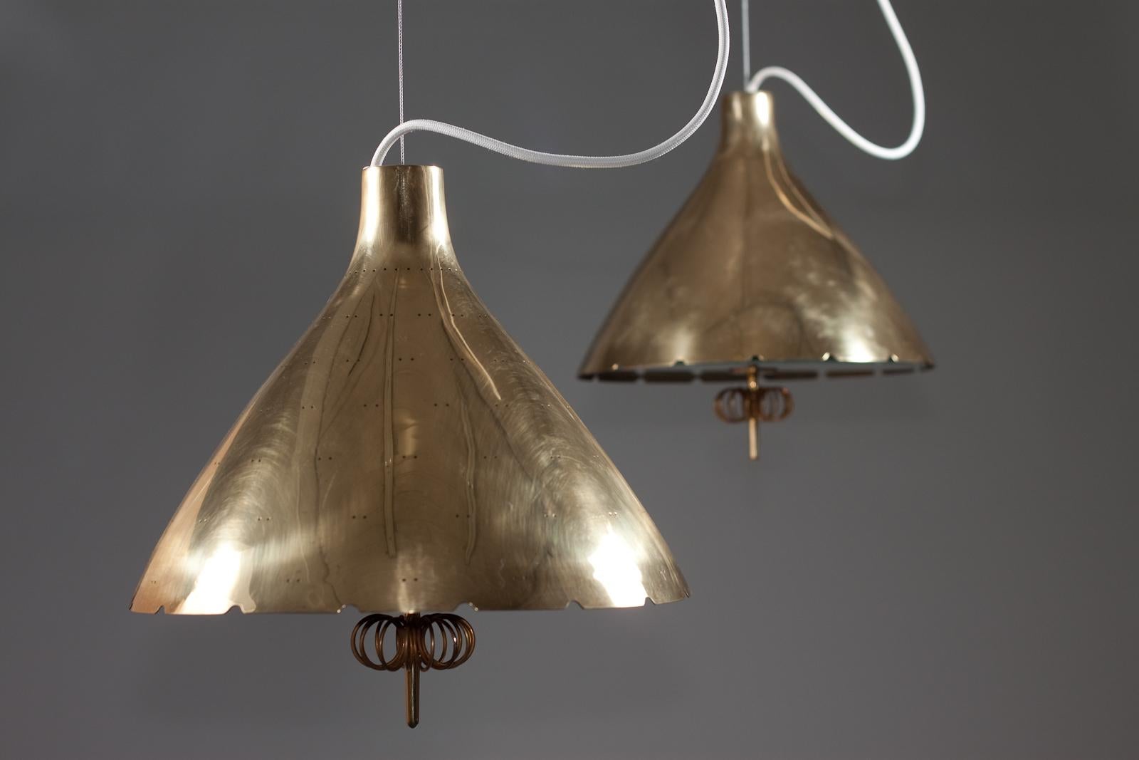 Paavo Tynell, pair of 1940's brass counterweight pendant lamps, Taito Oy 9