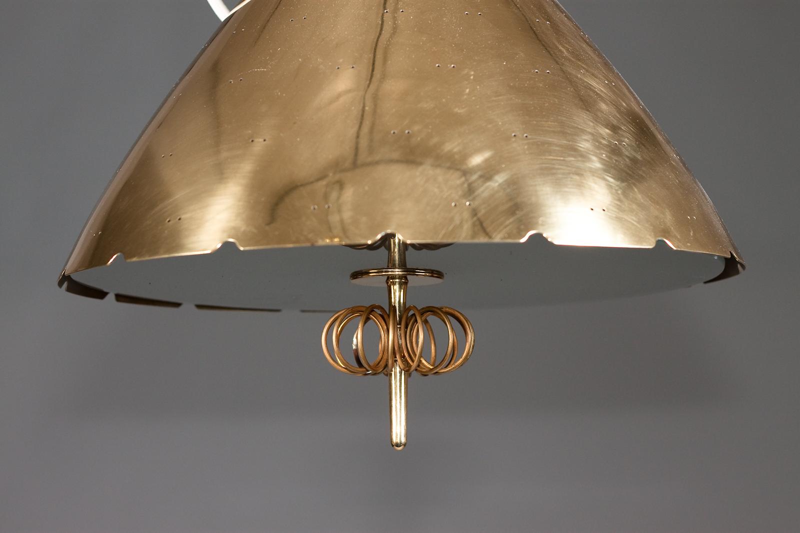 Brass Paavo Tynell, pair of 1940's brass counterweight pendant lamps, Taito Oy