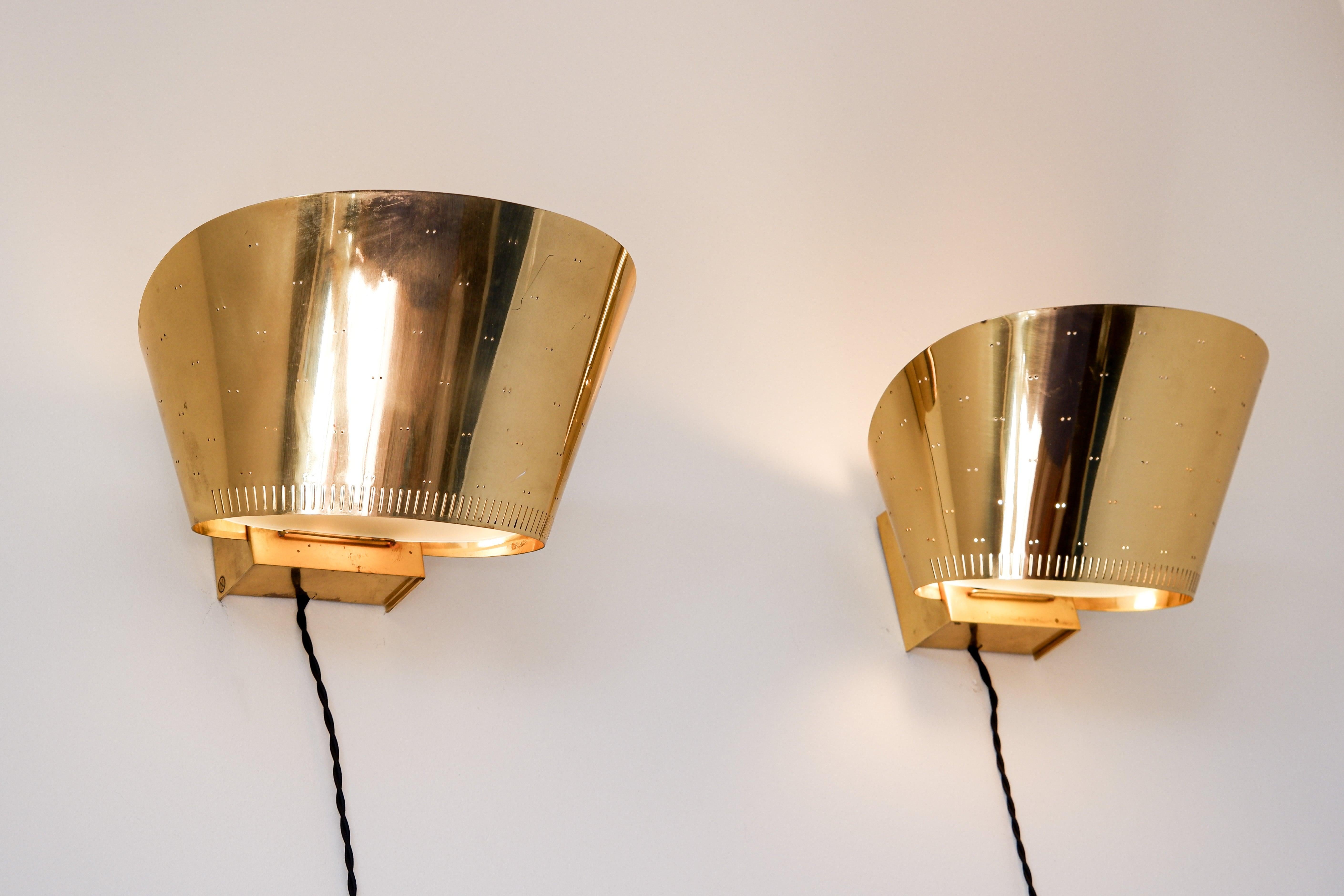 Scandinavian Modern Paavo Tynell, Pair of brass wall lamps model 9466 circa 1950.  For Sale