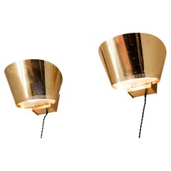 Vintage Paavo Tynell, Pair of brass wall lamps model 9466 circa 1950. 