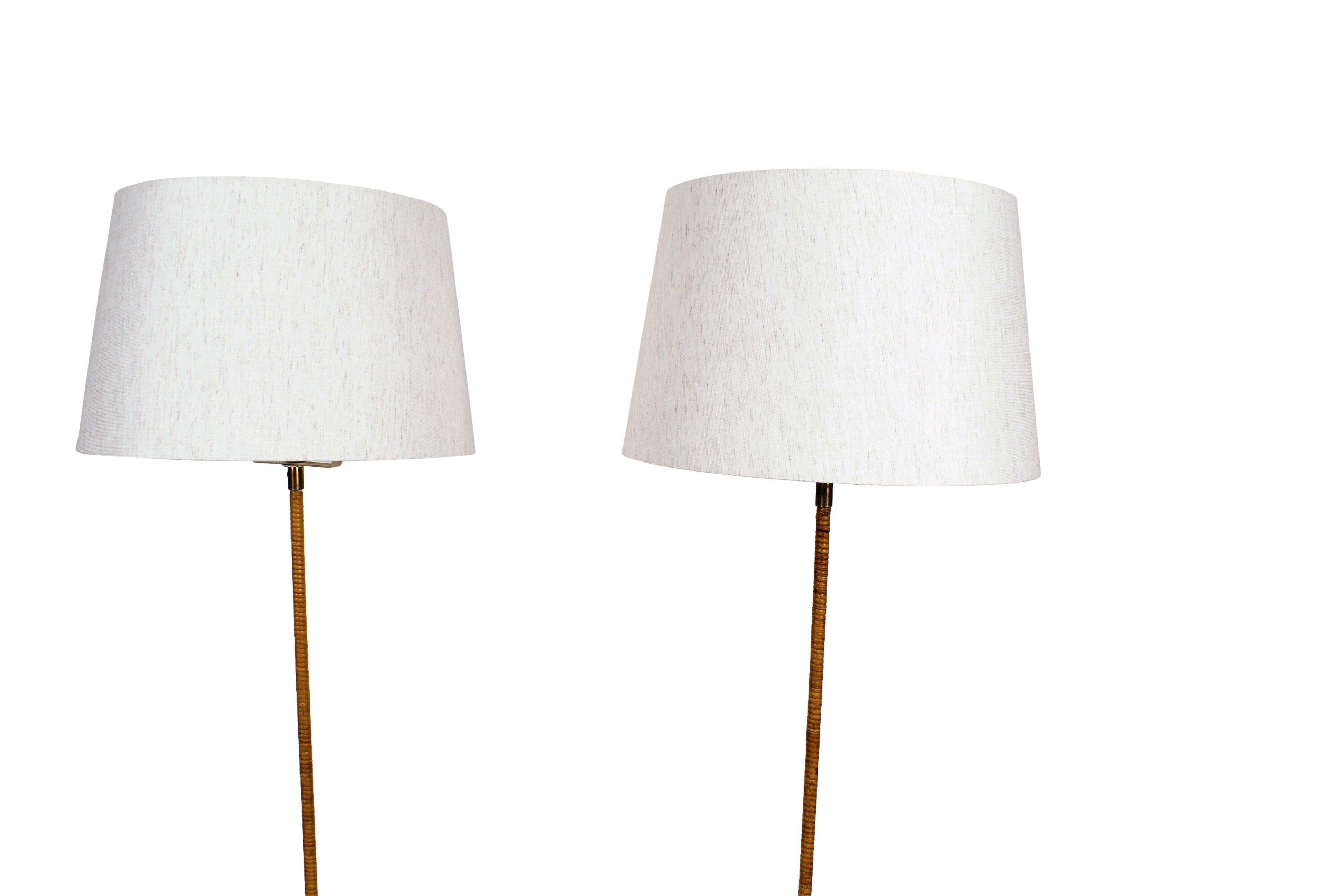 Paavo Tynell Pair of Floor Lamps in Brass and Cane for Taito, Model 9627, 1950s In Excellent Condition In Copenhagen, DK