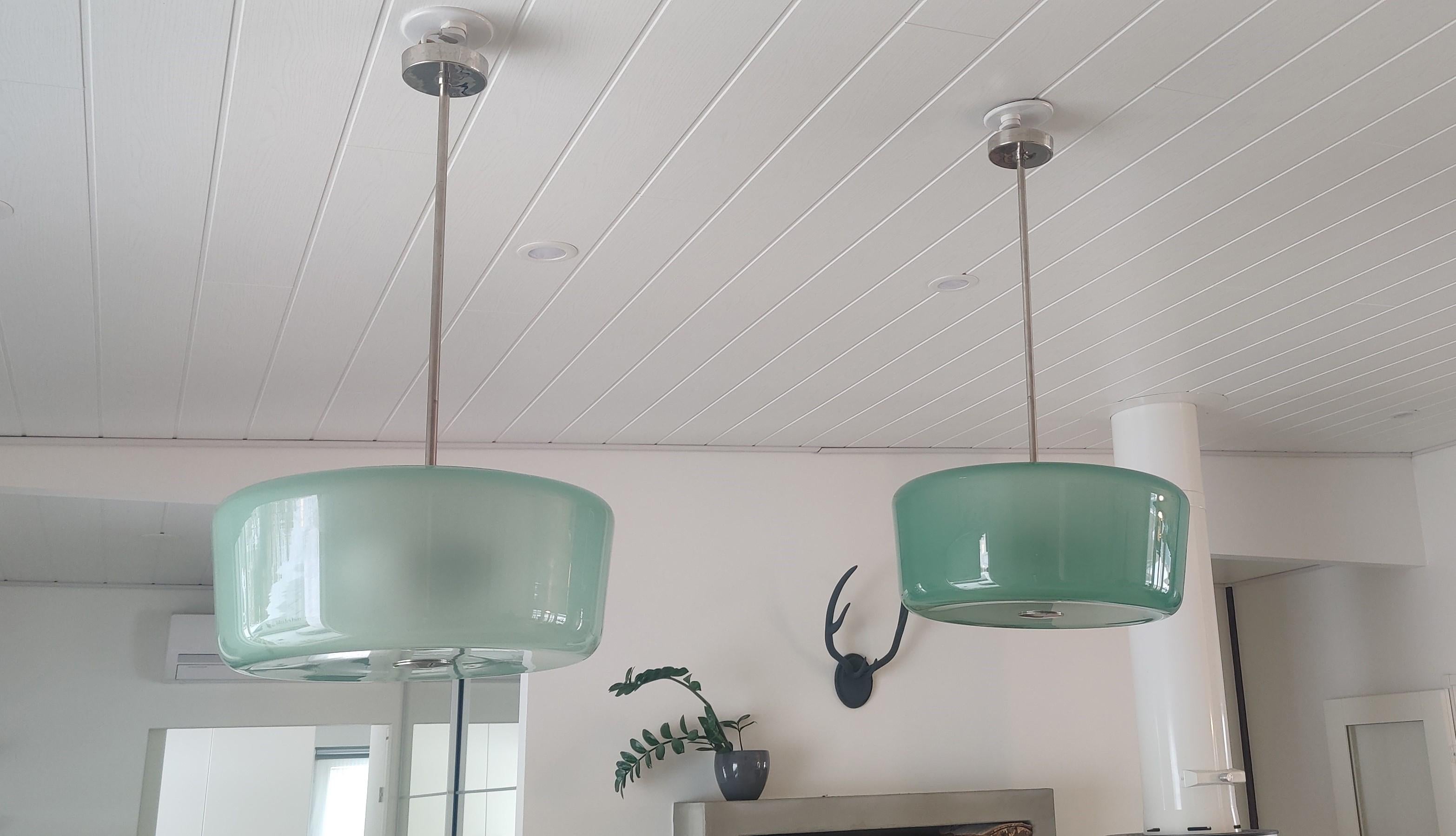 These two ceiling lamp is part of finnish history. 
They are from Helsinki Tennispalatsi ( tennis palace).

Tennispalatsi was built in 1938 in preparation for the 1940 Summer Olympics. The functionalist building, which had four tennis courts, was
