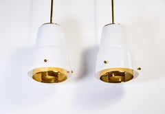 Paavo Tynell, pair of pendant lights in opal glass & brass circa 1950, Idman.