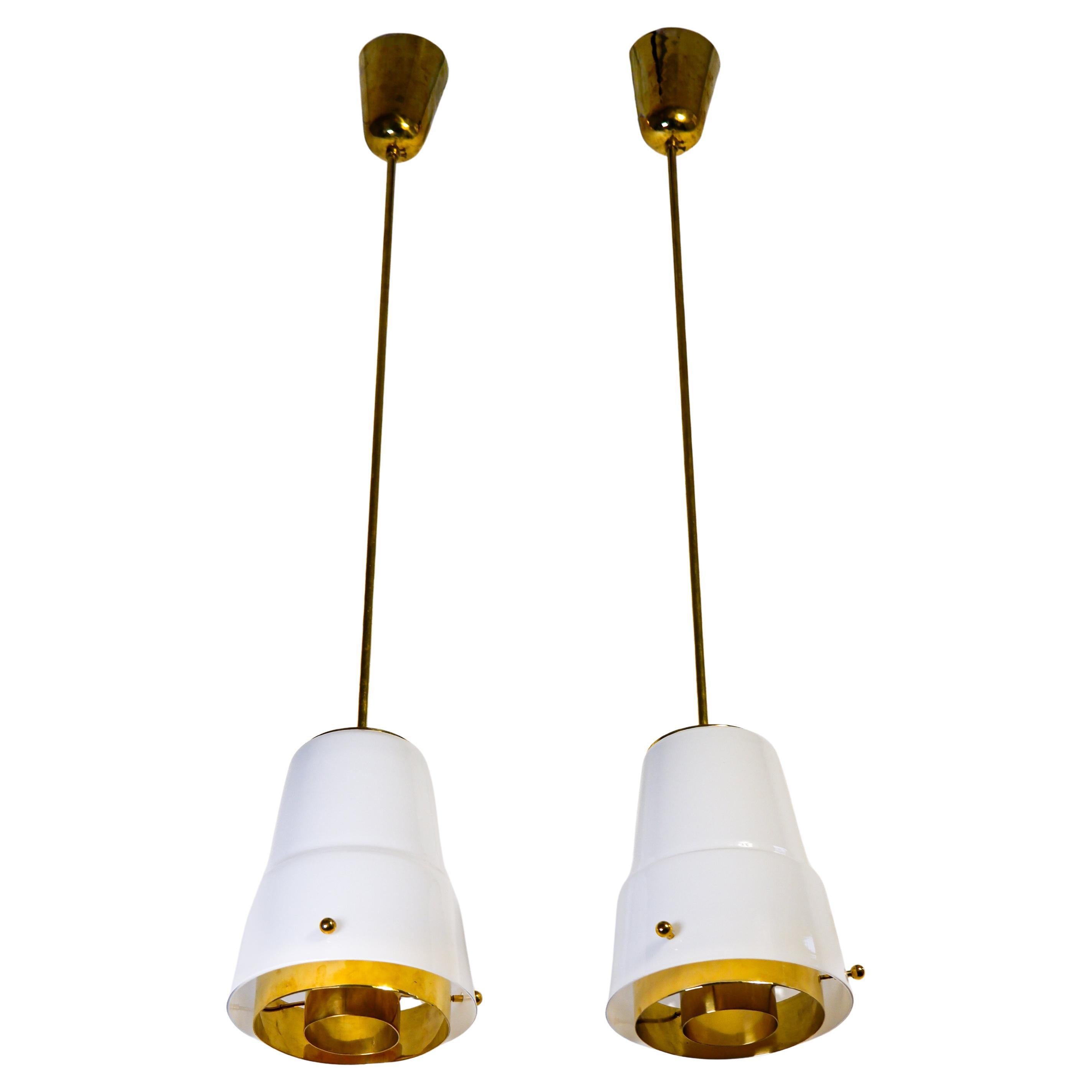 Paavo Tynell, pair of pendant lights in opal glass 
brass circa 1950, Idman.