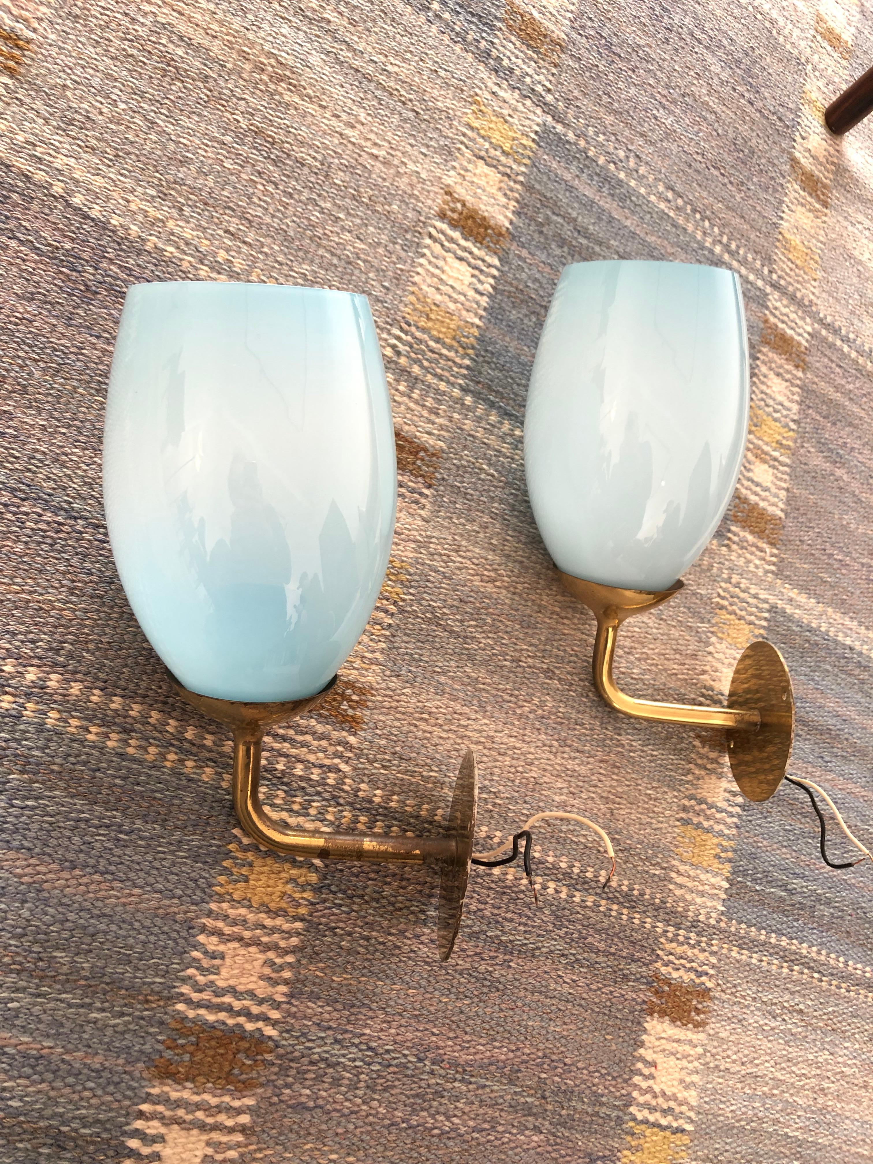 Finnish Paavo Tynell Pair of Wall Lights in brass and blue glass, 1940s For Sale