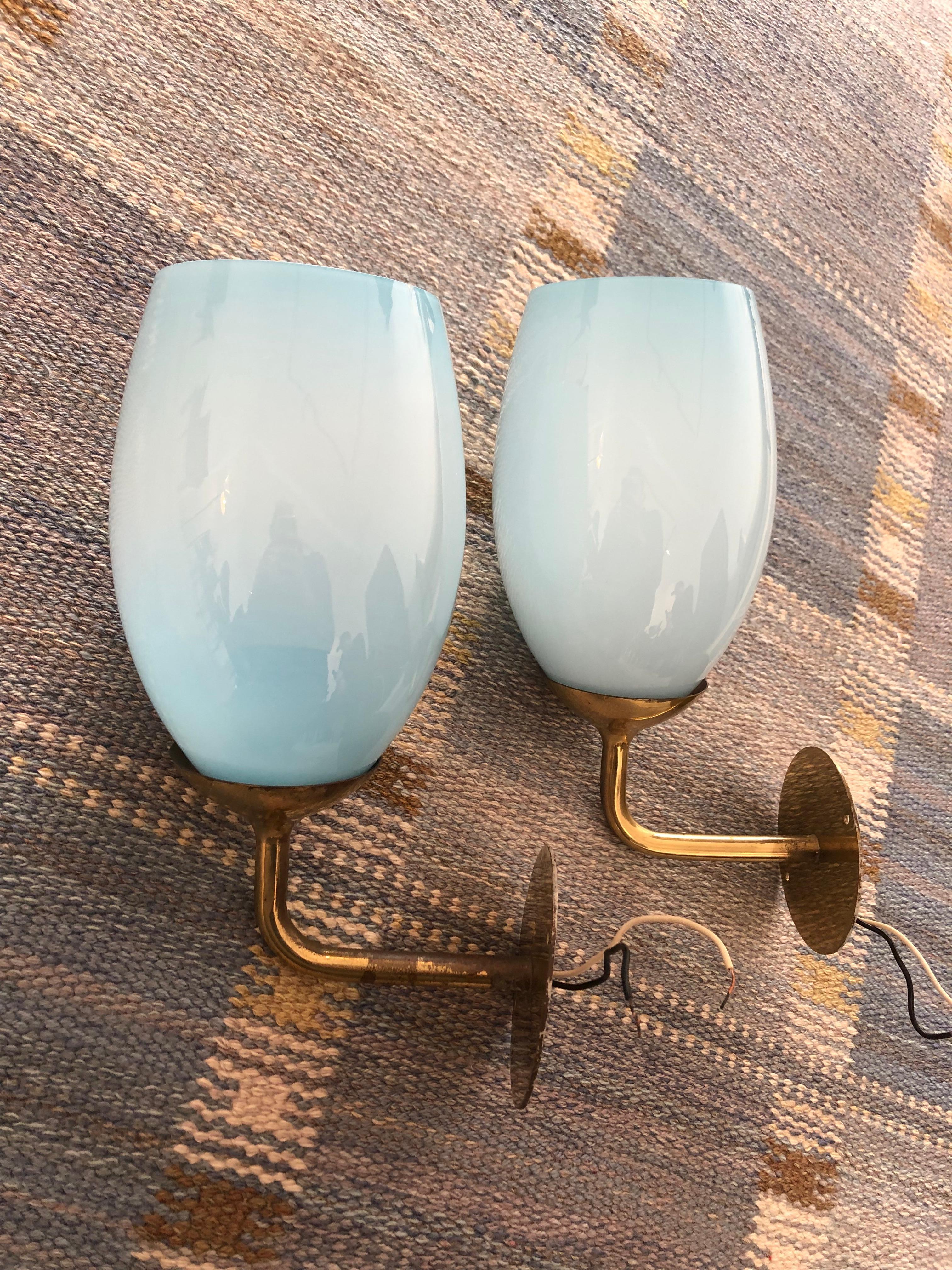 Mid-20th Century Paavo Tynell Pair of Wall Lights in brass and blue glass, 1940s For Sale