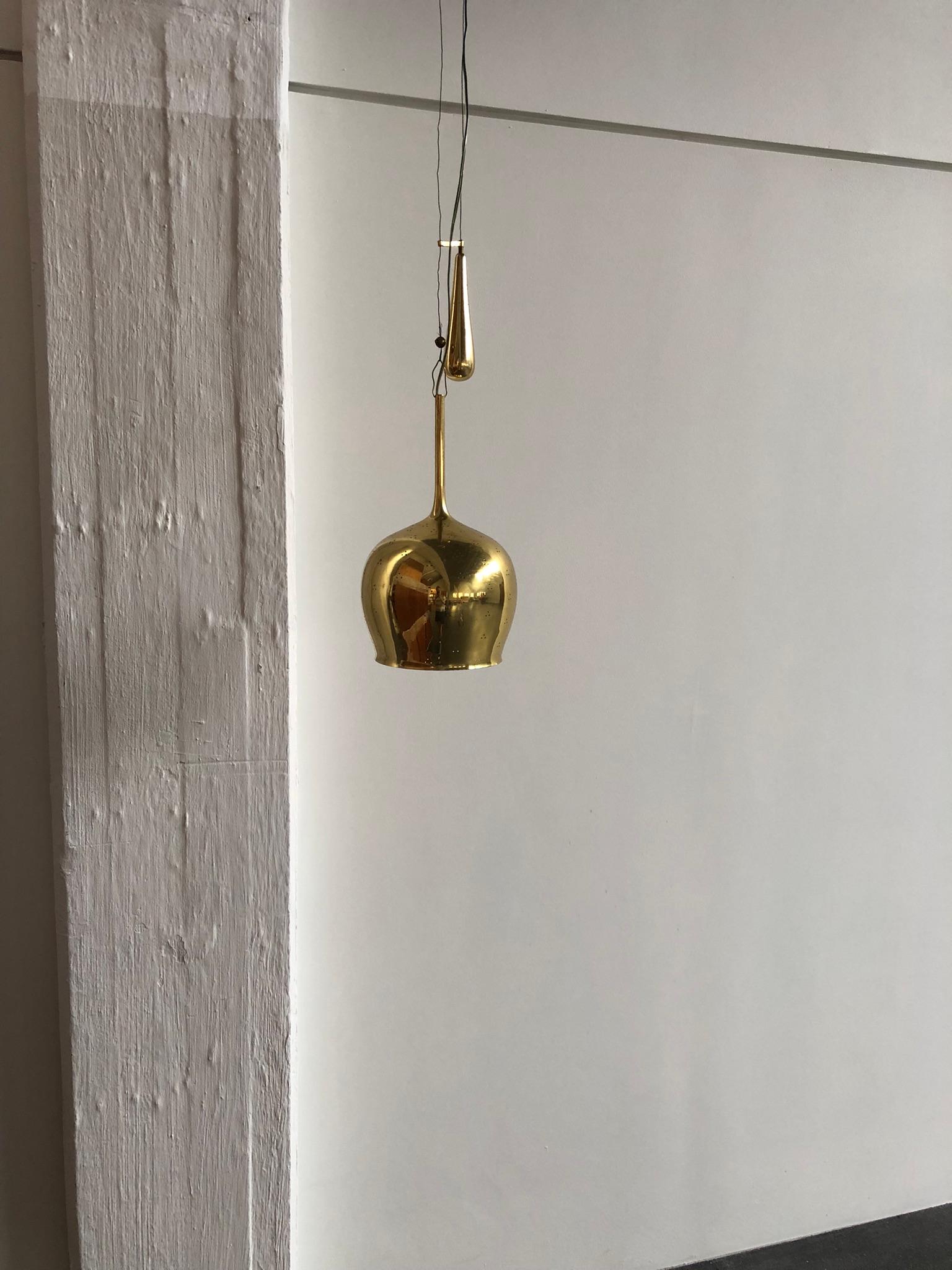 Scandinavian Modern Paavo Tynell Pendant in Perforated Brass with Counter Weight for Taito Oy For Sale