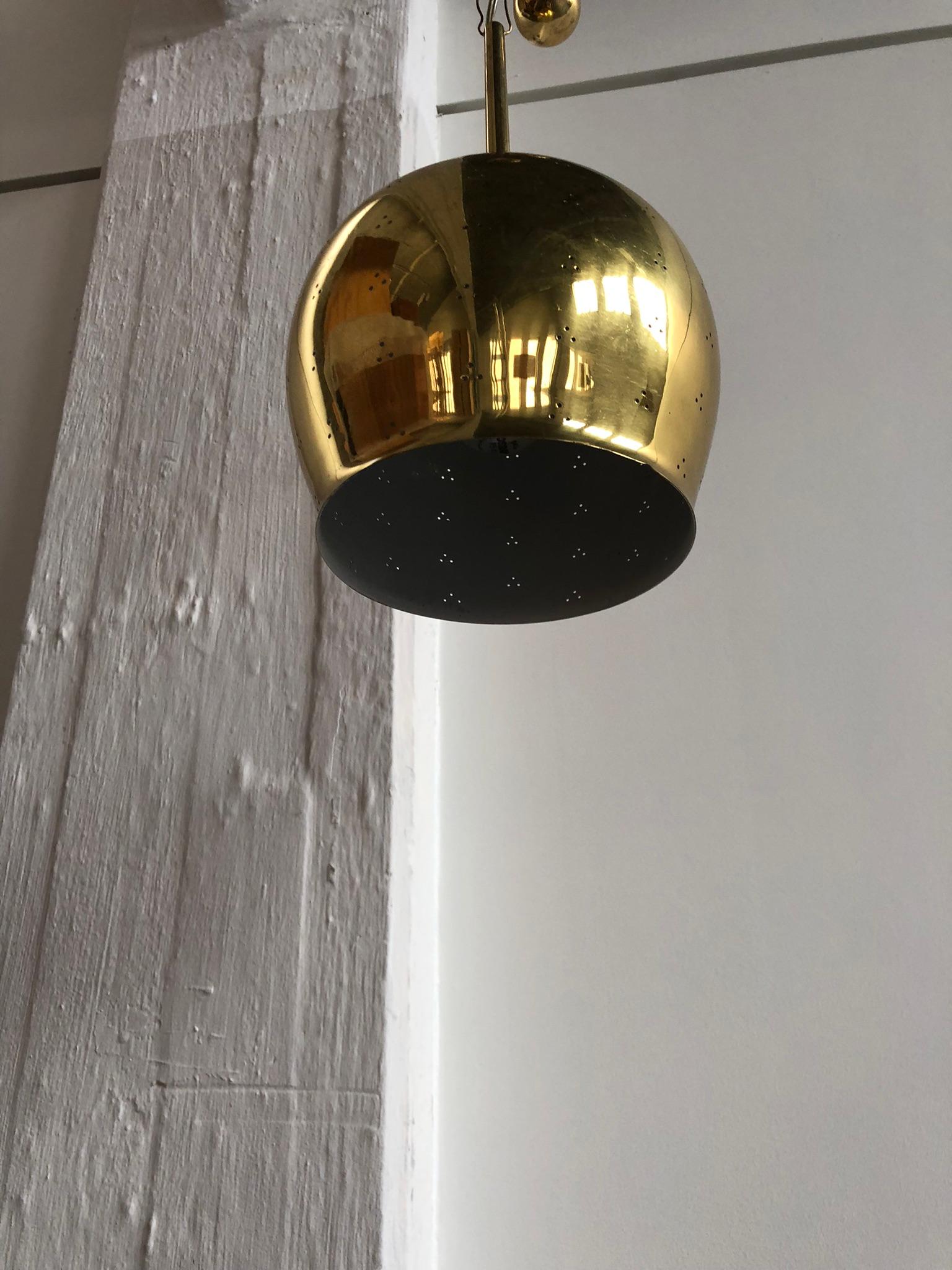 Paavo Tynell Pendant in Perforated Brass with Counter Weight for Taito Oy In Excellent Condition For Sale In Copenhagen, DK