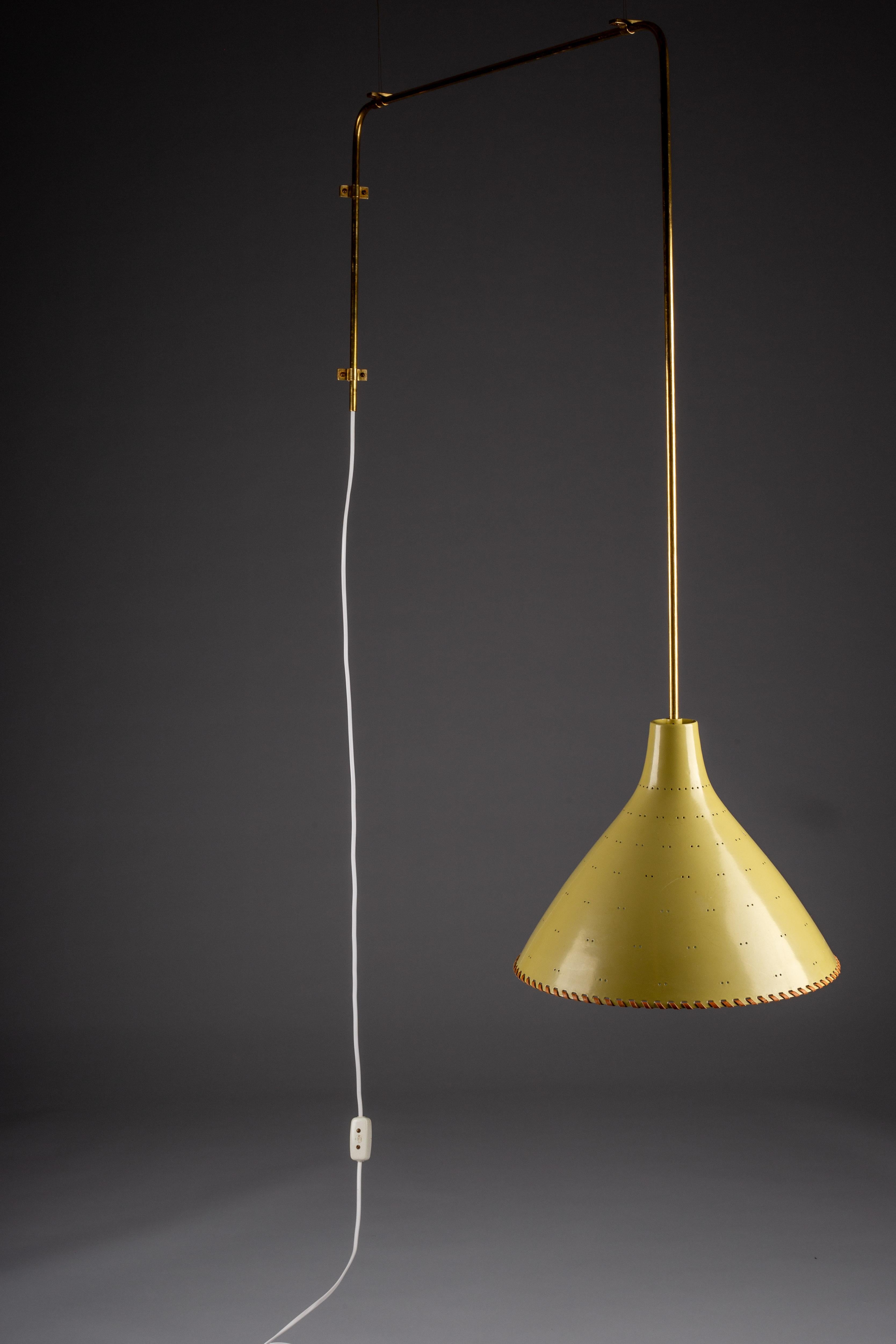 Experience the timeless elegance of the Paavo Tynell rare 1940's ceiling lamp, exclusively made to order by Taito Oy, Finland. This exquisite piece showcases intricate leather details and is mounted on wall and ceiling with brass brackets, making it