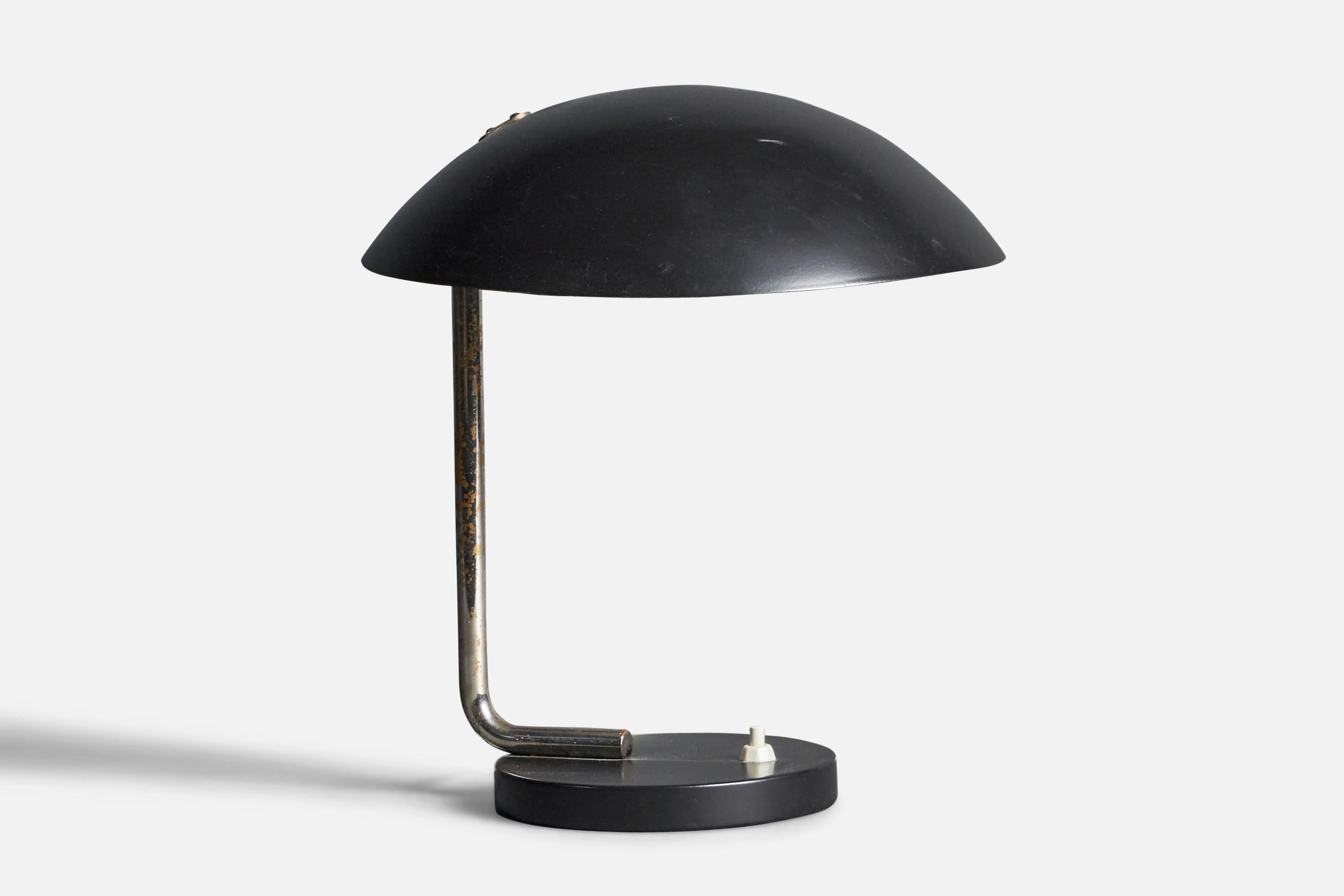 A rare and early table or desk lamp. Designed by Paavo Tynell in and produced by his own firm, Taito Oy. Impressed 