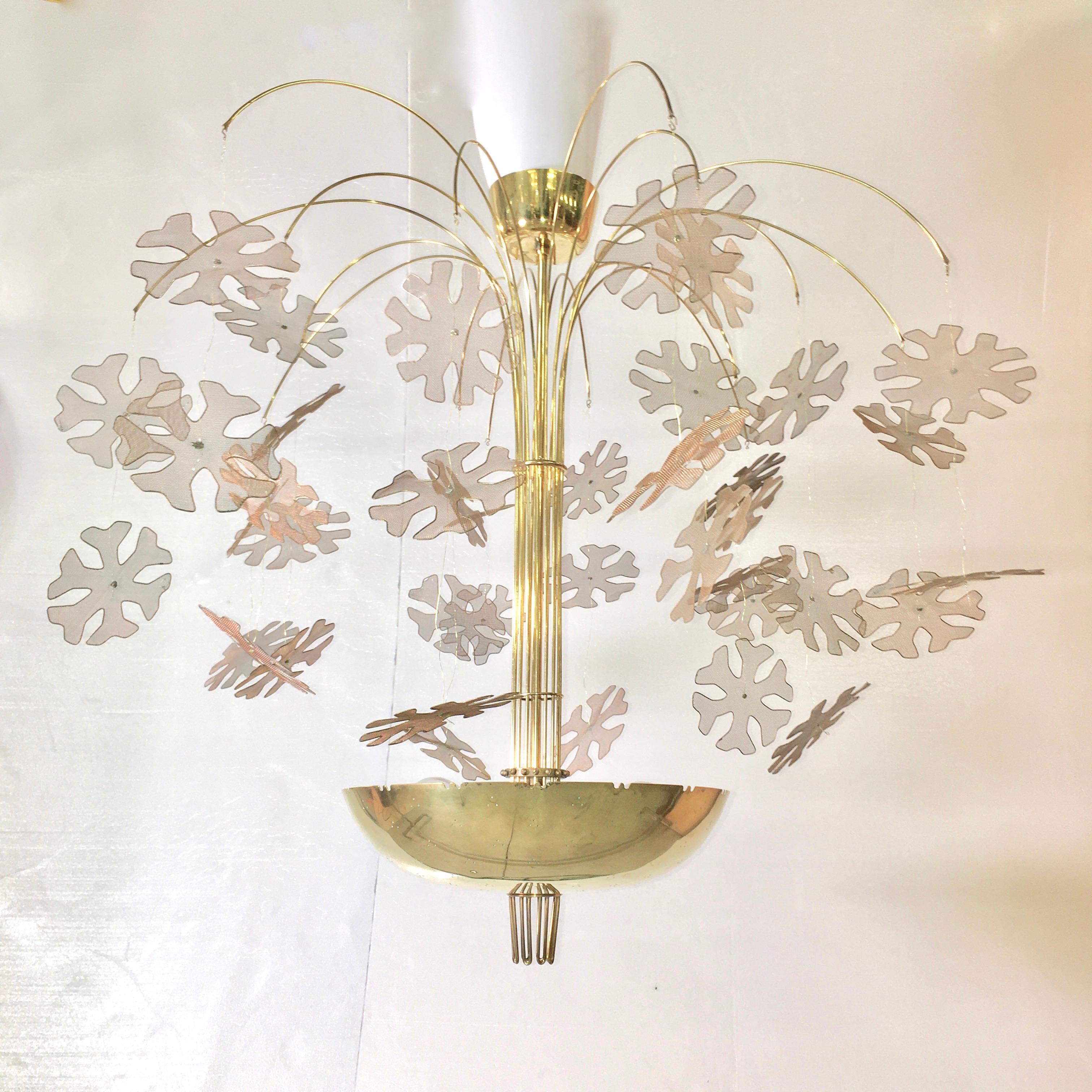 Original Model 10105/9041 Fantasia brass chandelier designed by Paavo Tynell and produced by Taito Oy Ab, Finland, 1950. 
Purchased through The Finland House showroom, 39-41 East 50th Street, New York, NY.
Pierced polished brass bowl with