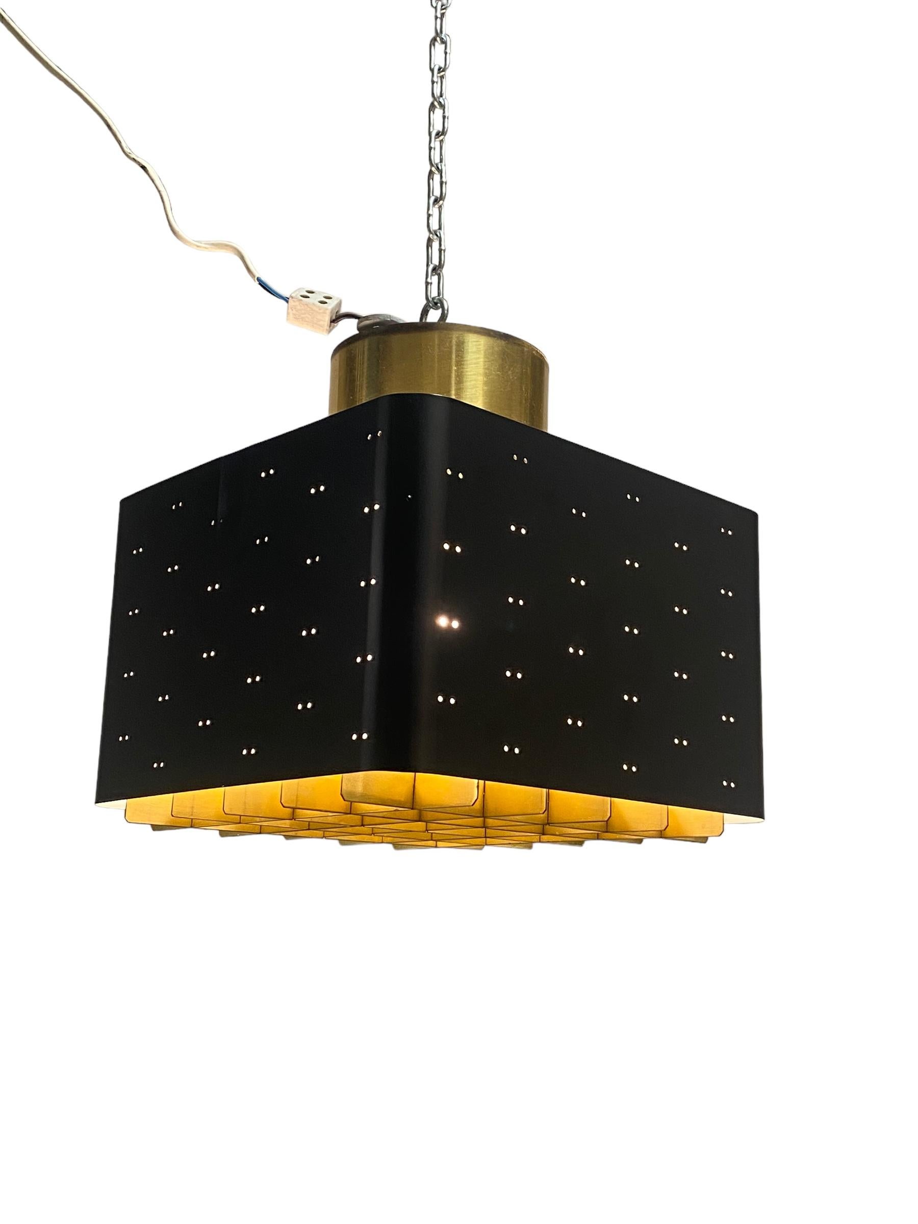 The Starry Sky is one of the most iconic designs of Paavo Tynell`s lamps. It was made by both Taito and Idman in a few different sizes. The way the light filters through the grill and the holes on the sides makes the ceiling look like a starry sky.