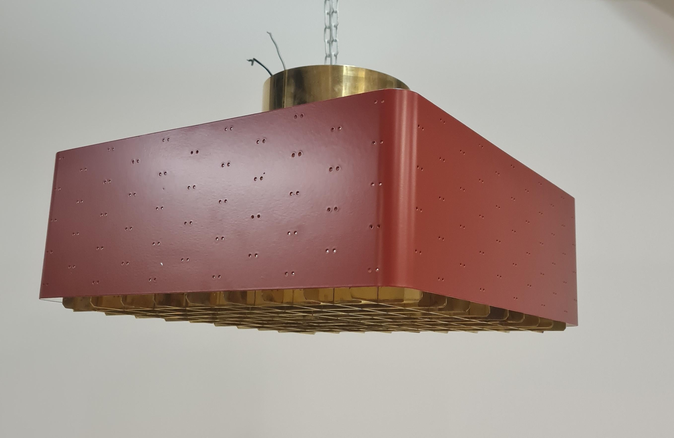 The Starry Sky is one of the most iconic designs of Paavo Tynell's lamps. It was made by both Taito and Idman in many different sizes. The way the light filters through the grill and the holes on the sides makes the ceiling look like a starry sky.