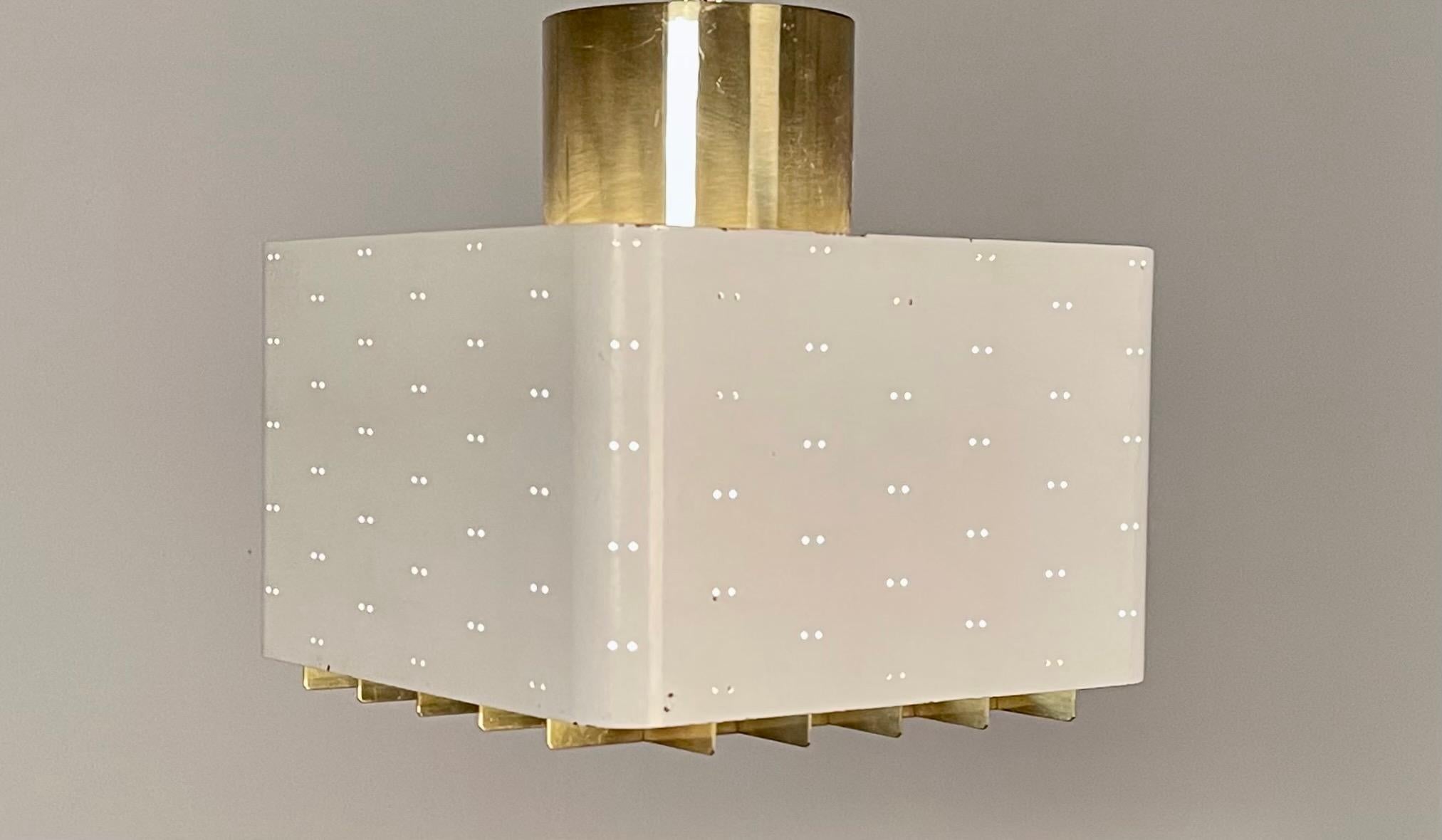 Paavo Tynell, white perforated, enameled metal, brass grill and frosted glass ceiling light
model 9068 'Starry Sky', smaller version.
Manufactured by Idman Oy,
Finland, 1950s.
Stamped with manufacturer's label.
Very nice vintage condition.