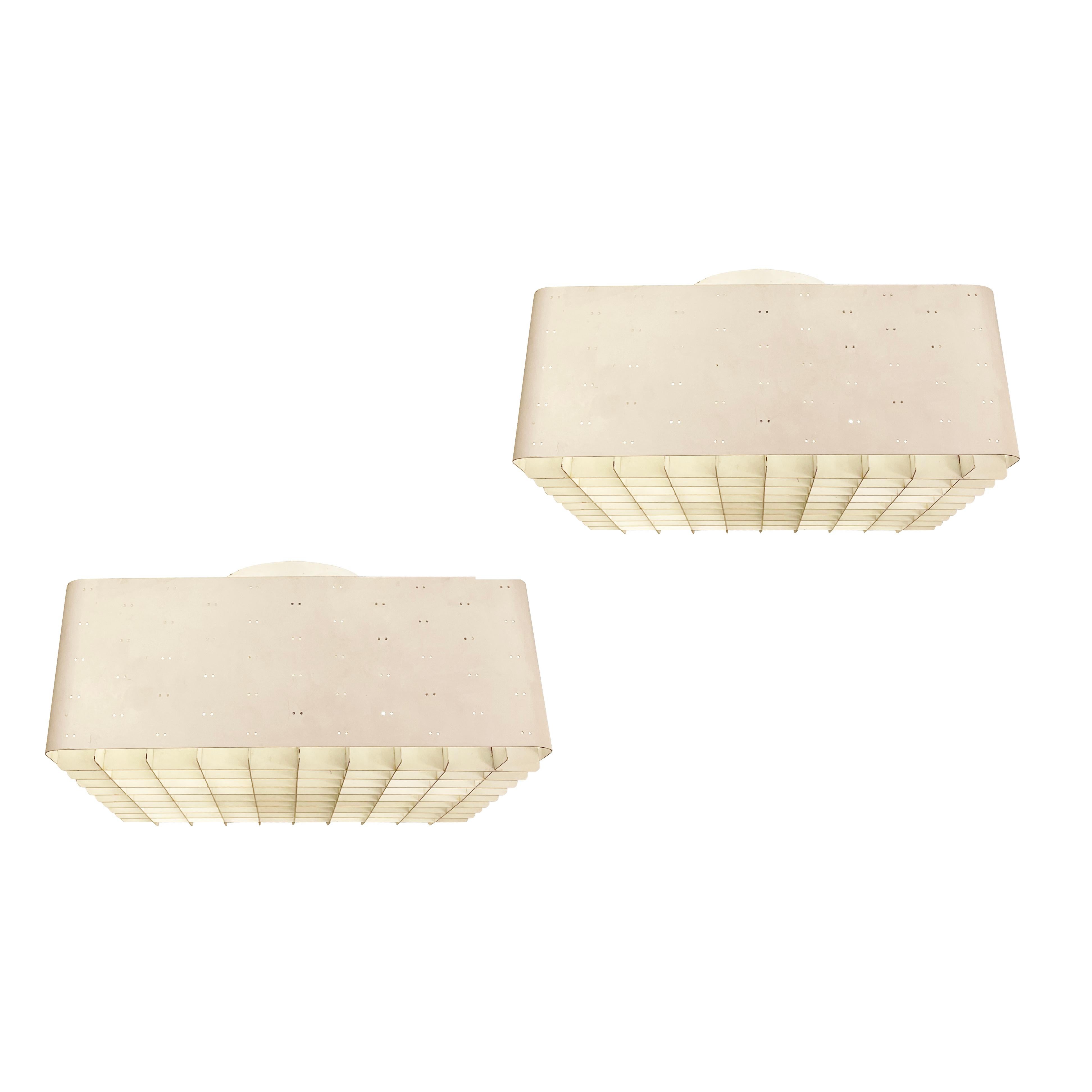 “Starry Sky” ceiling lights, Model 9068, designed by Paavo Tynell for Idman Oy. Finland 1960s. Each features a white perforated square shade with a frosted glass diffuser and grid. Each holds 4 E26 sockets. Two available- Price per