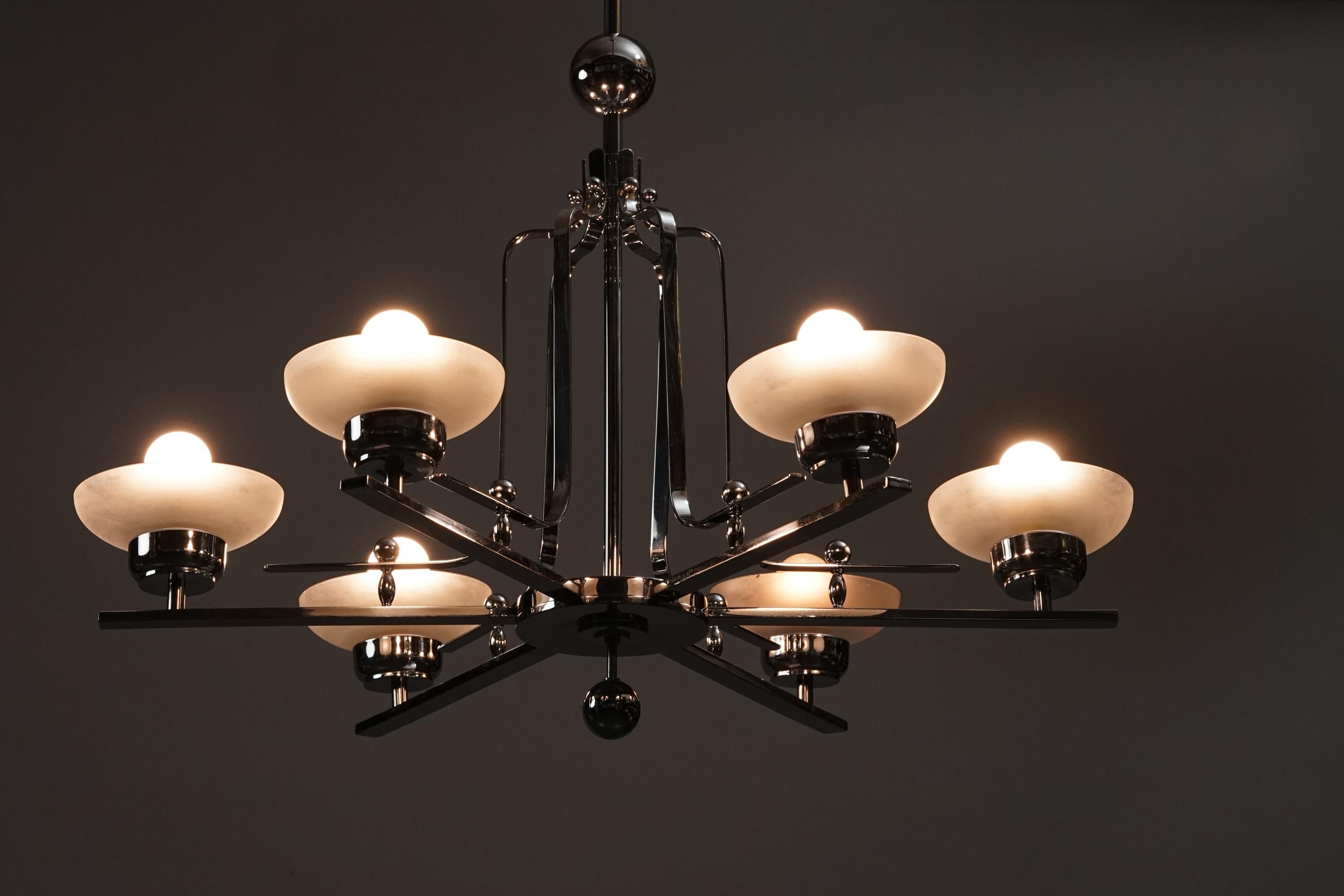 Paavo Tynell style rare chandelier from the early 1900s. Chromed metal frame with milk glass shades. Good vintage condition, minor wear and patina consistent with age and use. Beautiful Art Deco -style design.