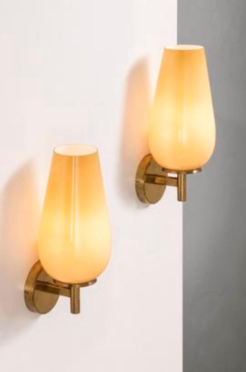 Rare Paavo Tynell church lamps pair, the lamp body is brass and the lampshade is glass, the lamp gives a soft light. stamped TAITO.