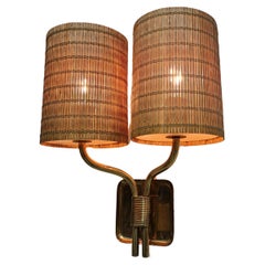 Paavo Tynell Illuminazione a parete con paralumi in rattan Modello WS/336 Taito