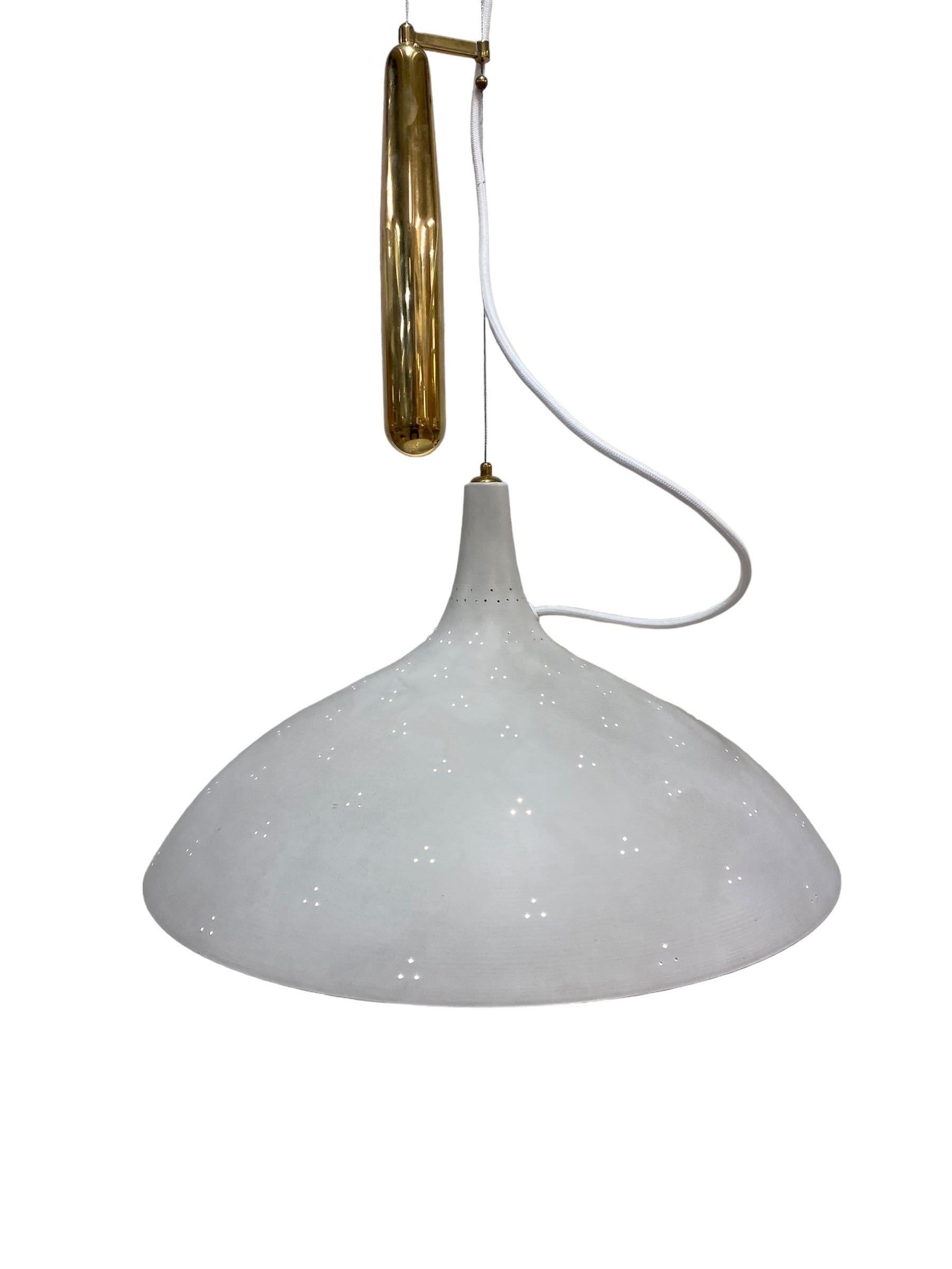 Paavo Tynell created the counter weight lamp design in response to American lamp specifications, that did not allow lamps to hang by electricity cords on their own. The result was a whole series of counter weight lamp designs of which this model,