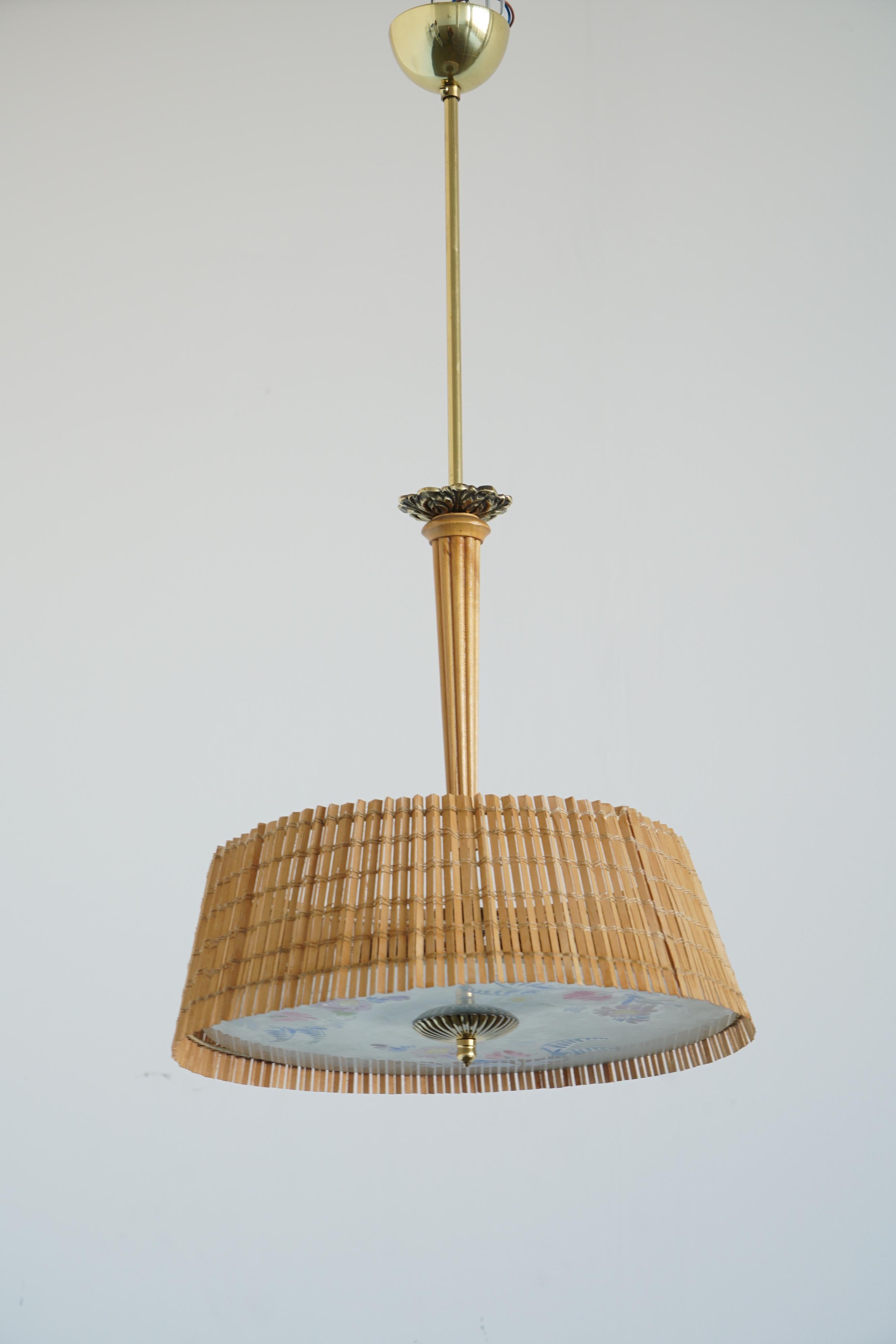 Paavo Tynell's ceiling light with hand painted glass diffuser by Kyllikki Salmenhaara, manufactured by Taito Oy, Finland, 1940-50s.
2 Edison sockets.
Two fixtures available with different paint pattern.
Rewiring available upon request.