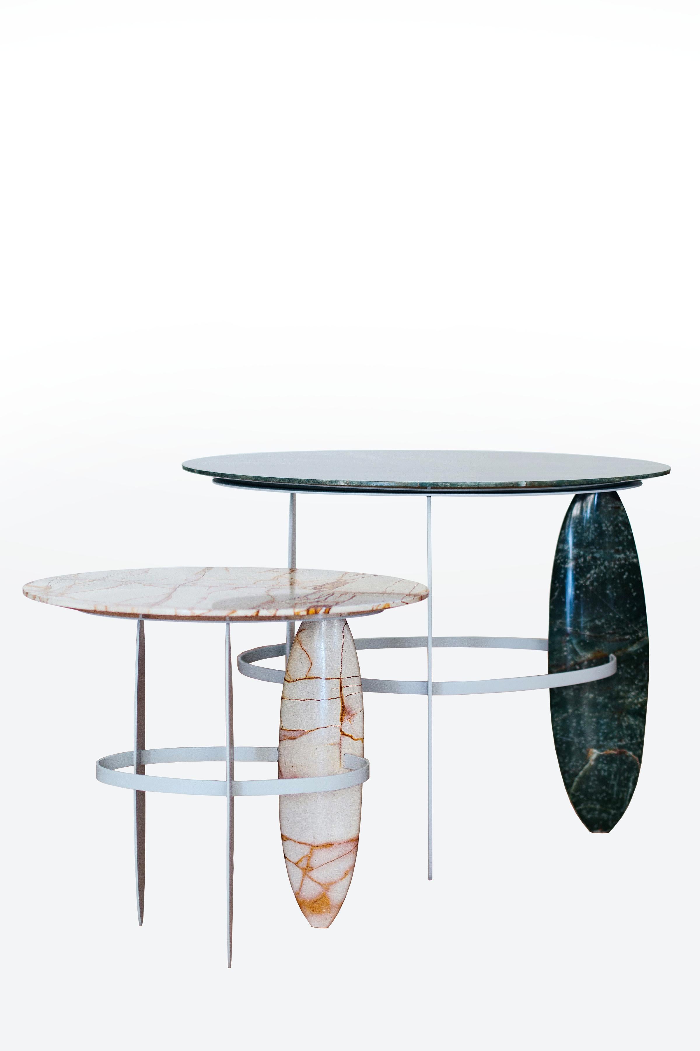 A set of sophisticated Brazilian semiprecious quartzite and pure quartz stone hand sculpted side table.  One table made with the rare Brazilian 