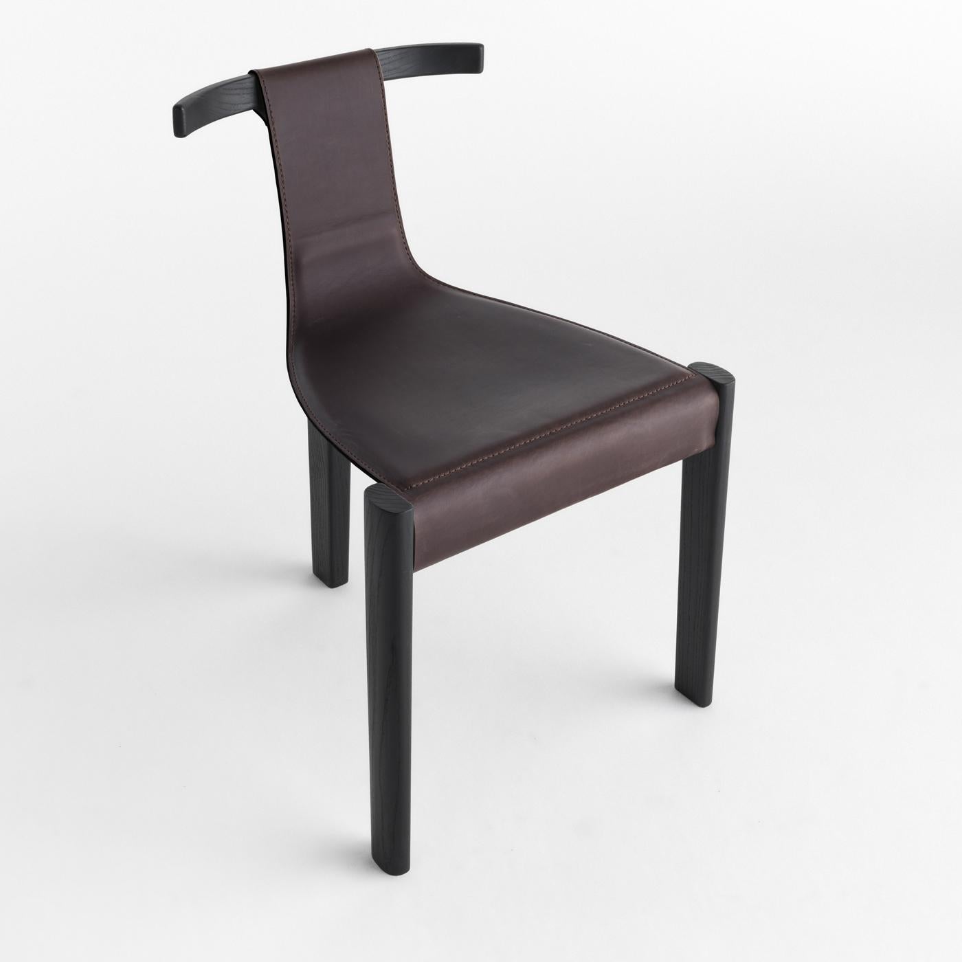 Reminiscent of Picasso’s cubist sculptures and signature style, this three-legged chair designed by Marcello Pozzi is a lightweight and refined piece of functional decor. It is composed of solid black ash supporting frame and backrest, the latter