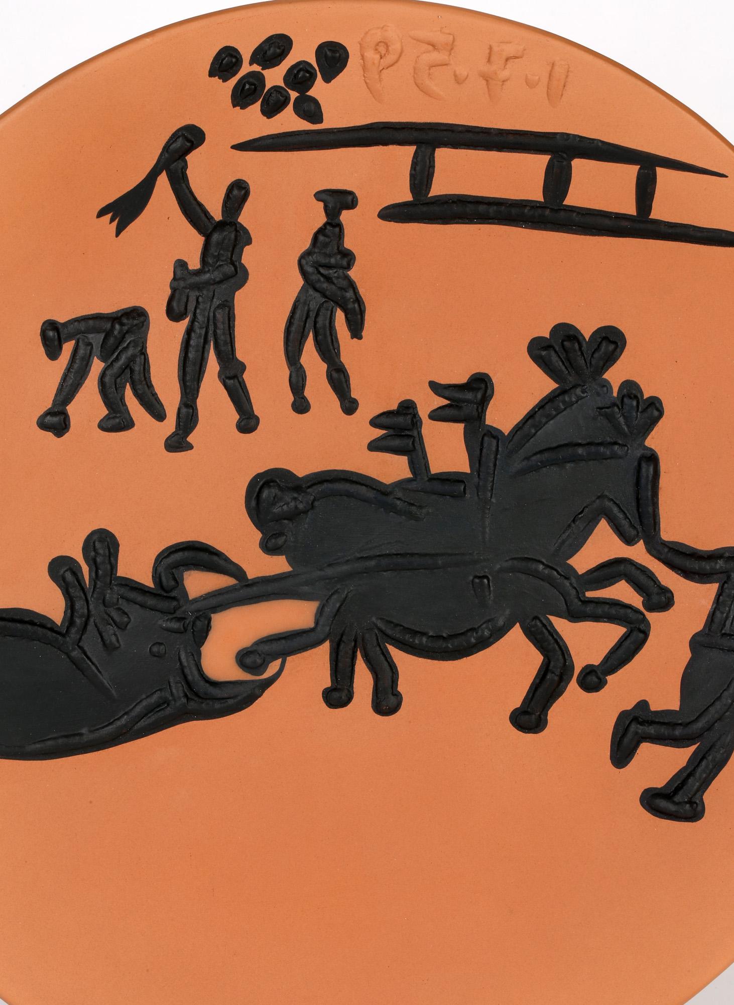 A stylish Arrastro (A.R. 431) terre de faience limited edition dish from a bull fight series and portraying the bull being towed from the arena by dress horses by Pablo Picasso and dated 1st July 1959. The rounded dish is potted in terracotta