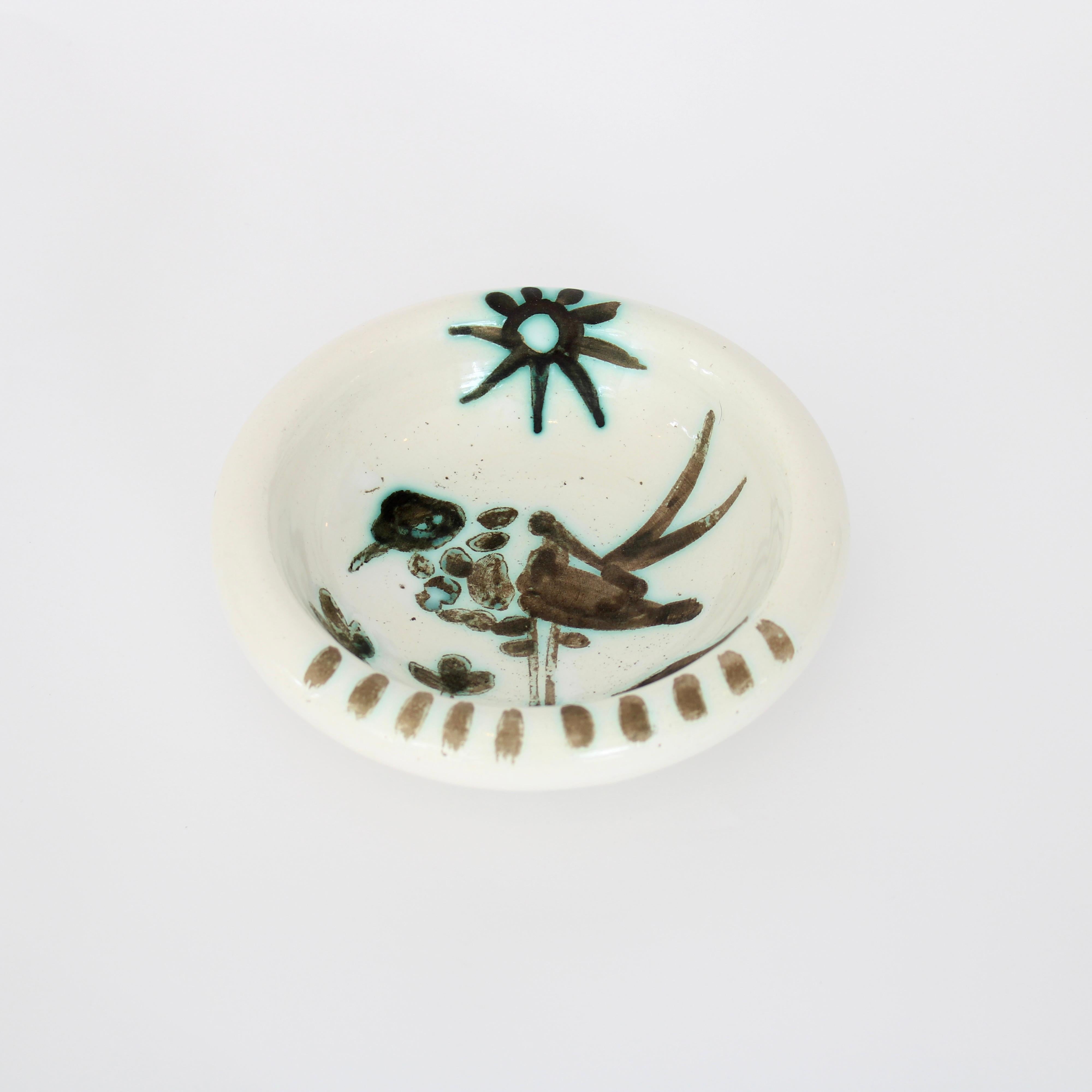 Pablo Picasso Oiseau Bird with Sun dish editions Picasso Madoura France. Circa 1952. Impressed with mark to underside Madoura Plein Feu edition Picasso and also with edition Picasso. 
From an edition of 500. There were 6 different dishes that